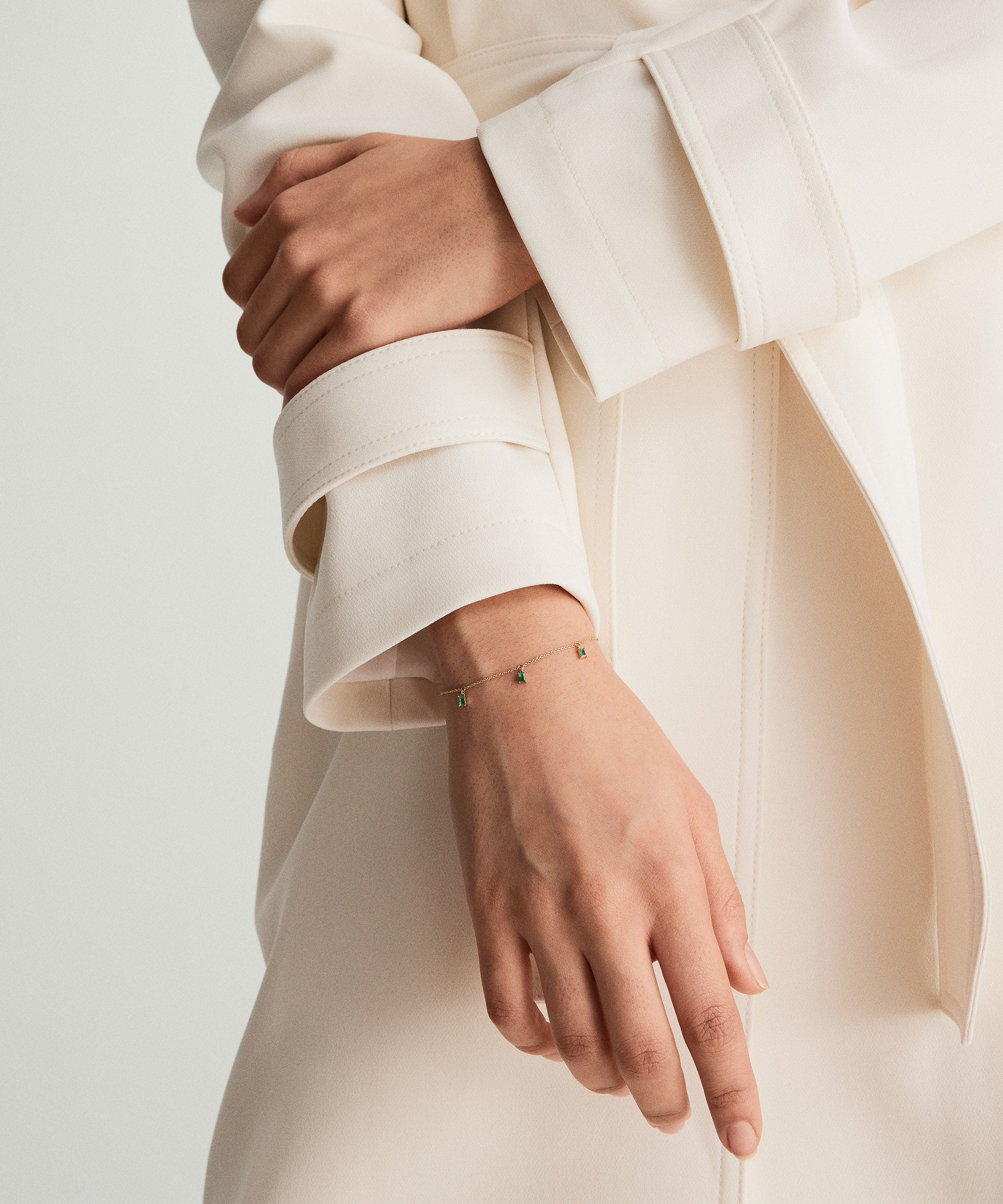 Close-up of a hand wearing the Baguette Gemstone Bracelet, showcasing its elegant design and standout stacking potential.