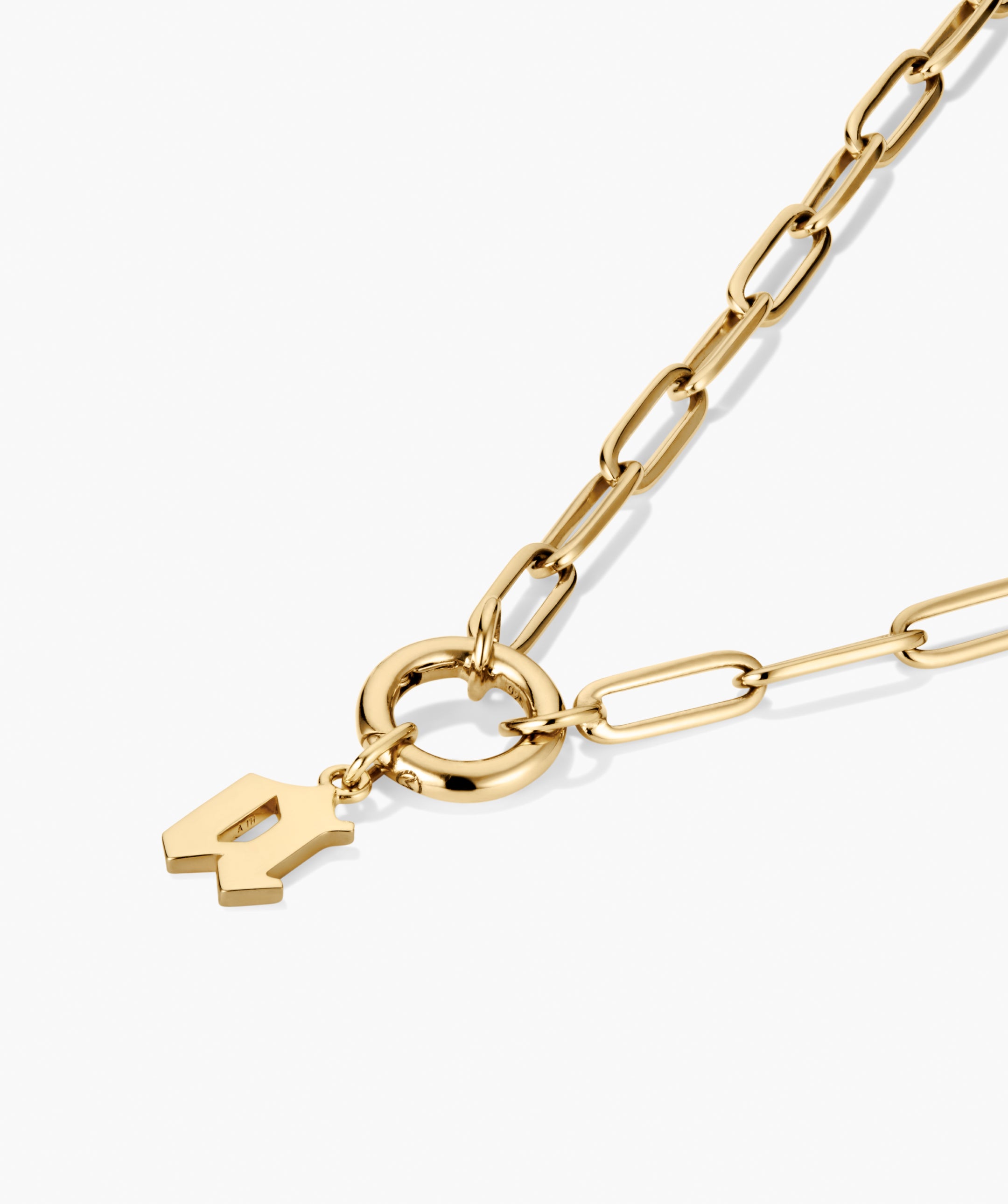 Gothic Letter Pendant necklace with elongated oval links, circular toggle clasp, and abstract geometric charm, offering a stylish, edgy aesthetic.