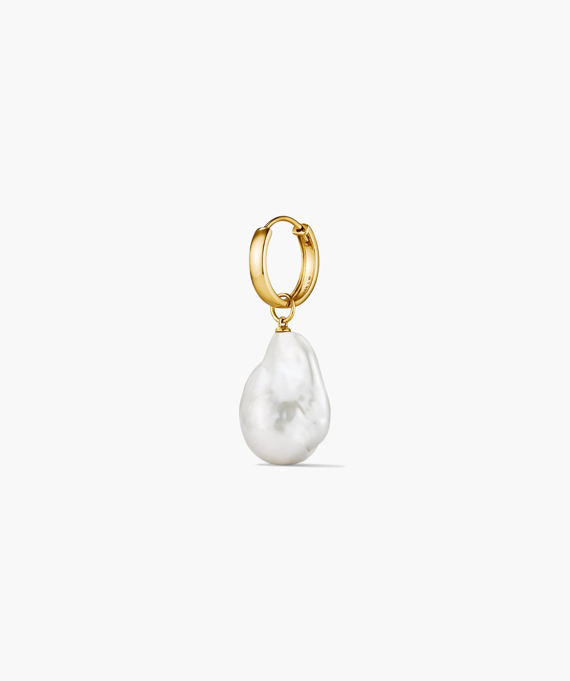 Oversized Baroque Pearl Hoop Charm featuring an irregular, sculptural pearl suspended from a sleek gold hoop, ideal for pairing with various earrings for a statement look.