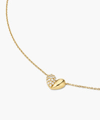 Better Half Heart Necklace showcasing a dual design: one half polished gold, the other pavÃ©-set with sparkling stones, perfect for layering.