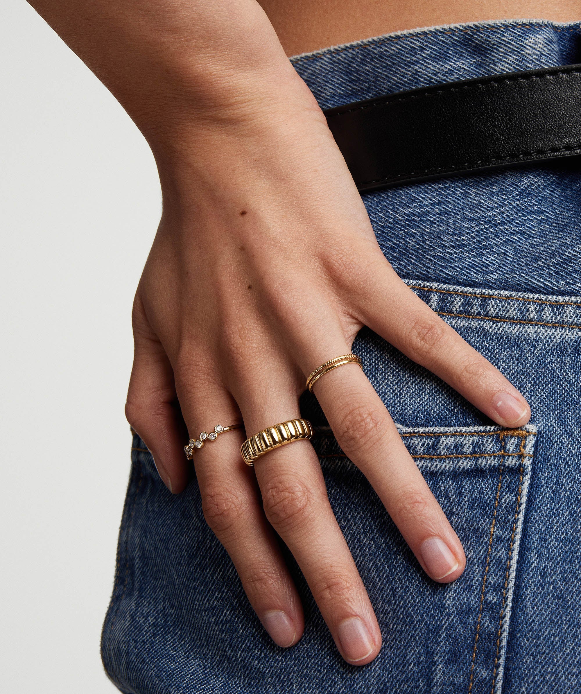 Hand wearing the Bezel Lab Grown Diamond Zig-Zag Ring, featuring bezel-set lab grown diamonds in 14k solid gold.