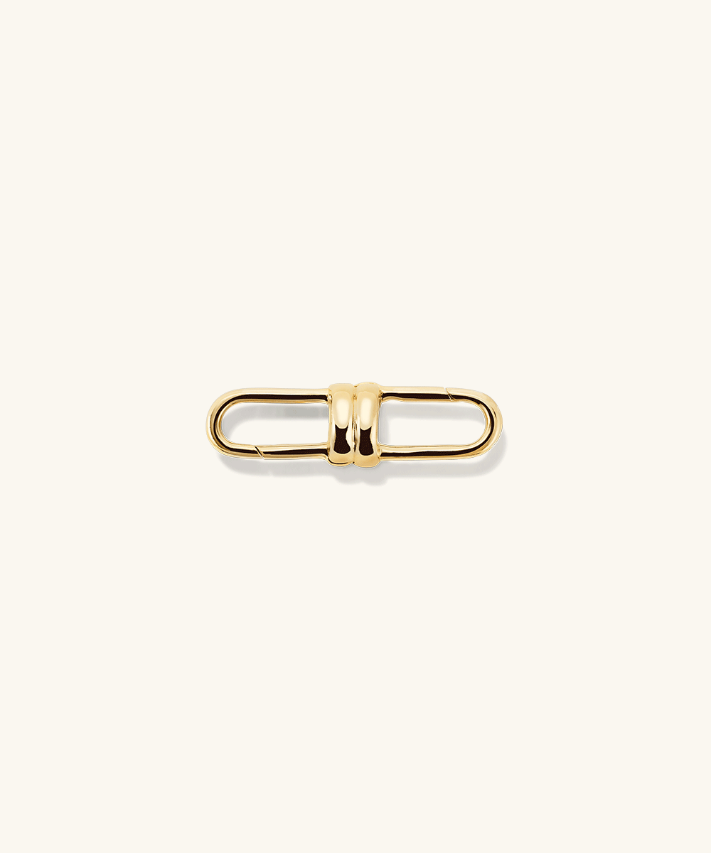 Base Chain Convertible Necklace, featuring a detailed gold metal clasp, designed for customizable styling with removable links for varied lengths and charm attachments.
