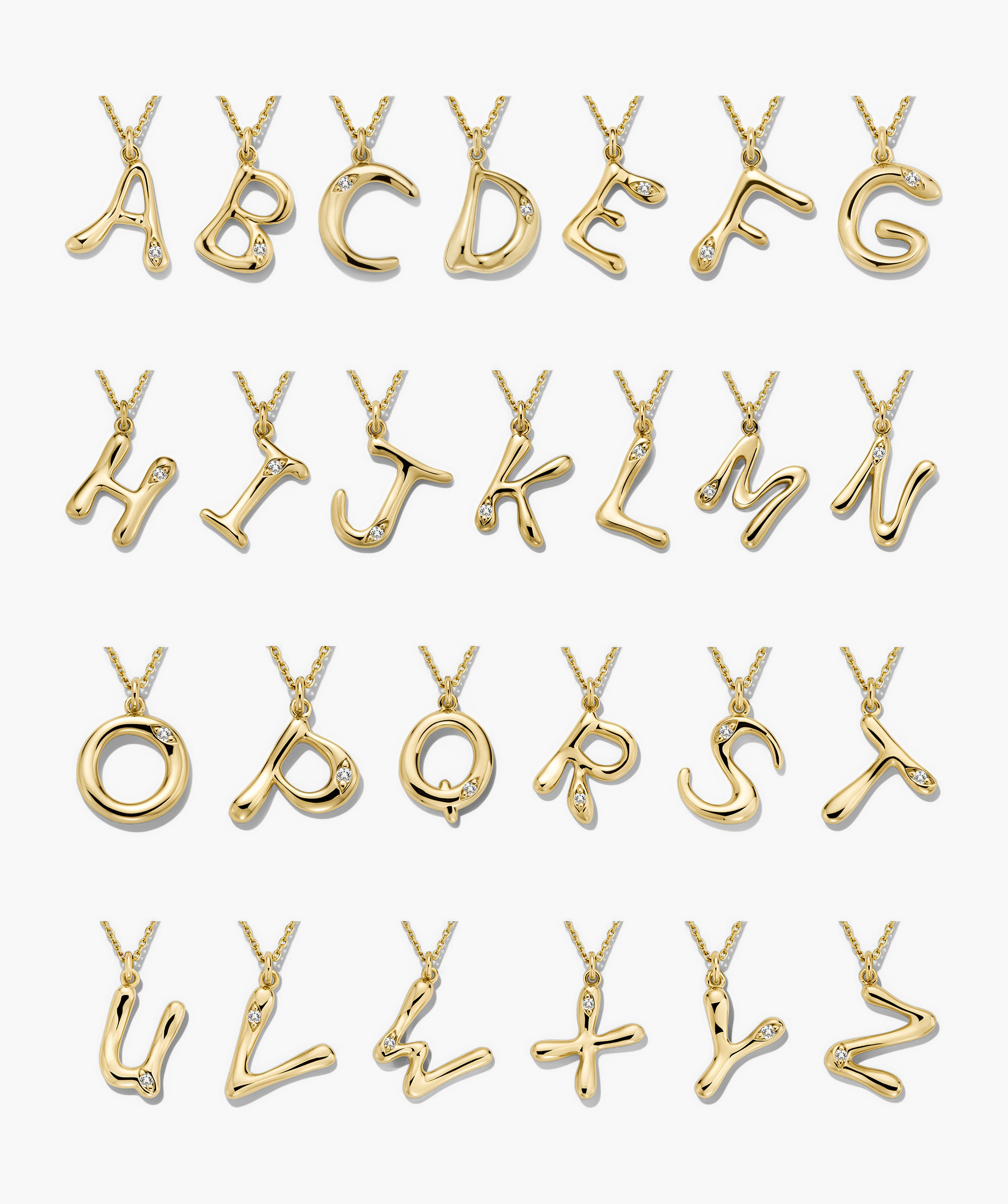 Organic DÃ´me Liquid Letter Pendant Necklace with unique gold letters and gemstones, showcasing a personalized, organic design.
