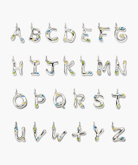 Organic DÃ´me Liquid Letter Pendant in silver, featuring a unique design with colorful gemstones, showcasing an initial for personalization.