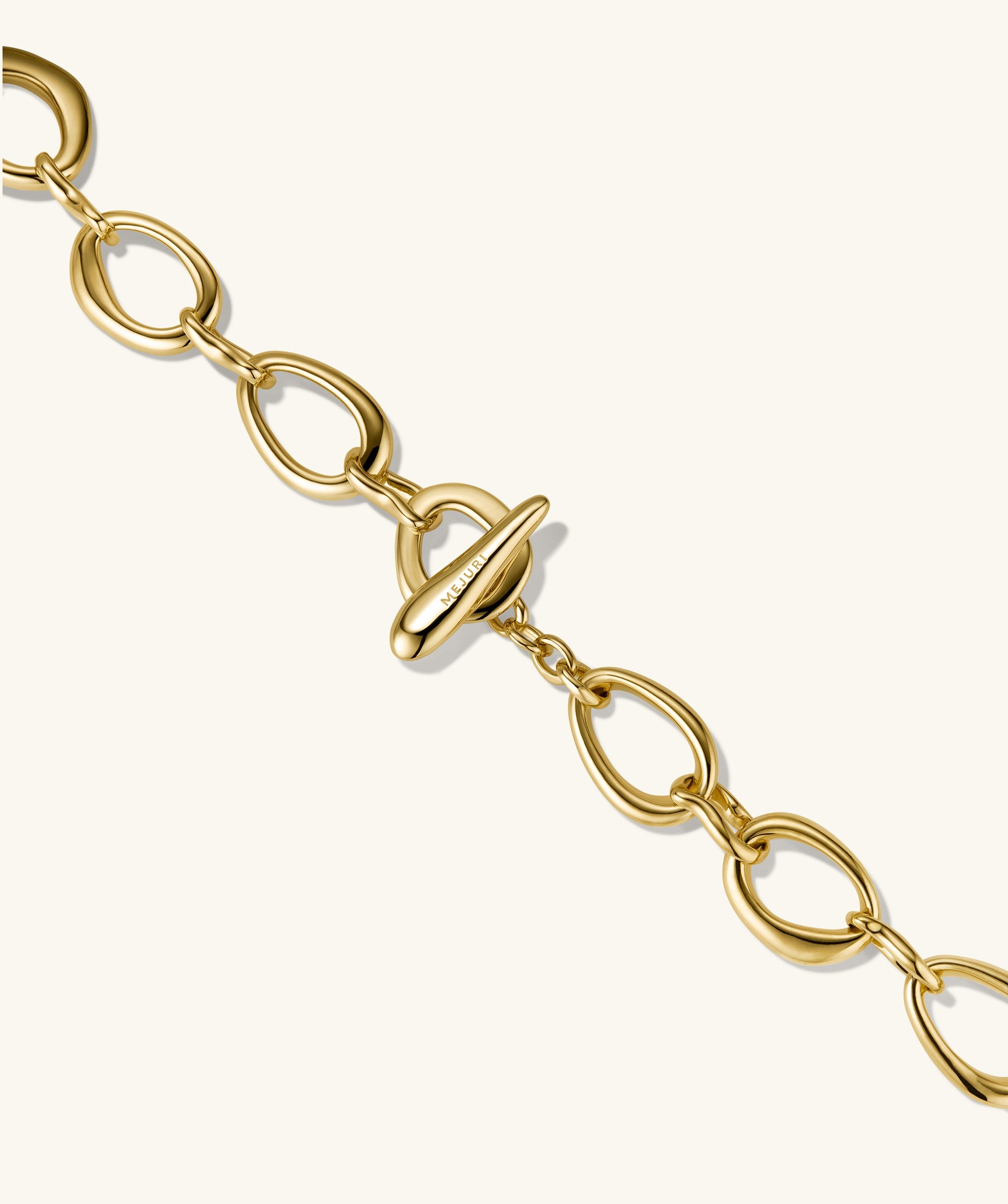 Organic DÃ´me Ripple Chain Necklace featuring organic, irregular links and a toggle clasp, offering a fluid design that enhances any outfit.