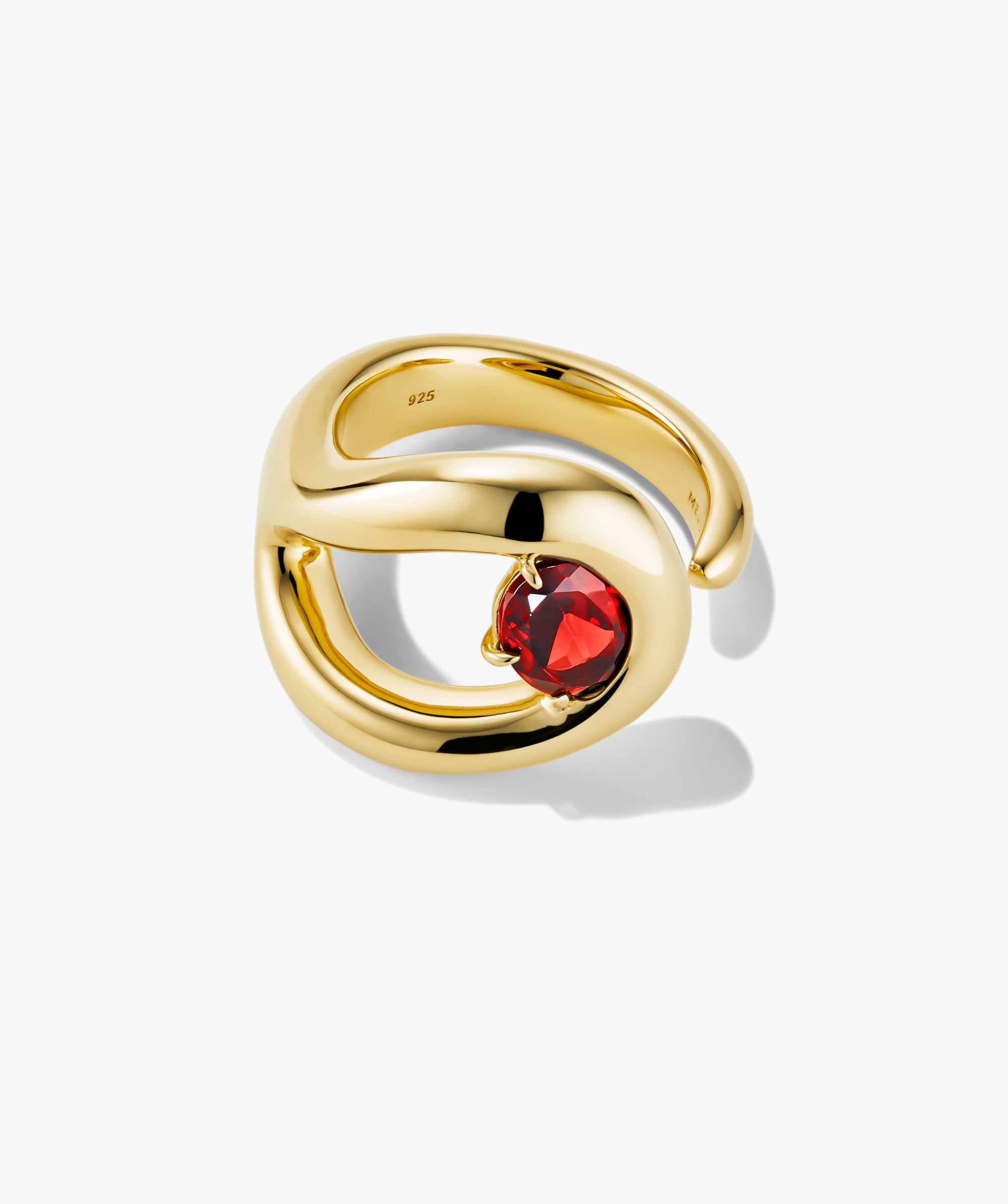 Organic DÃ´me Curve Gemstone Ring featuring a gold band with a prominent red gem, showcasing intricate curves and negative space design elements.