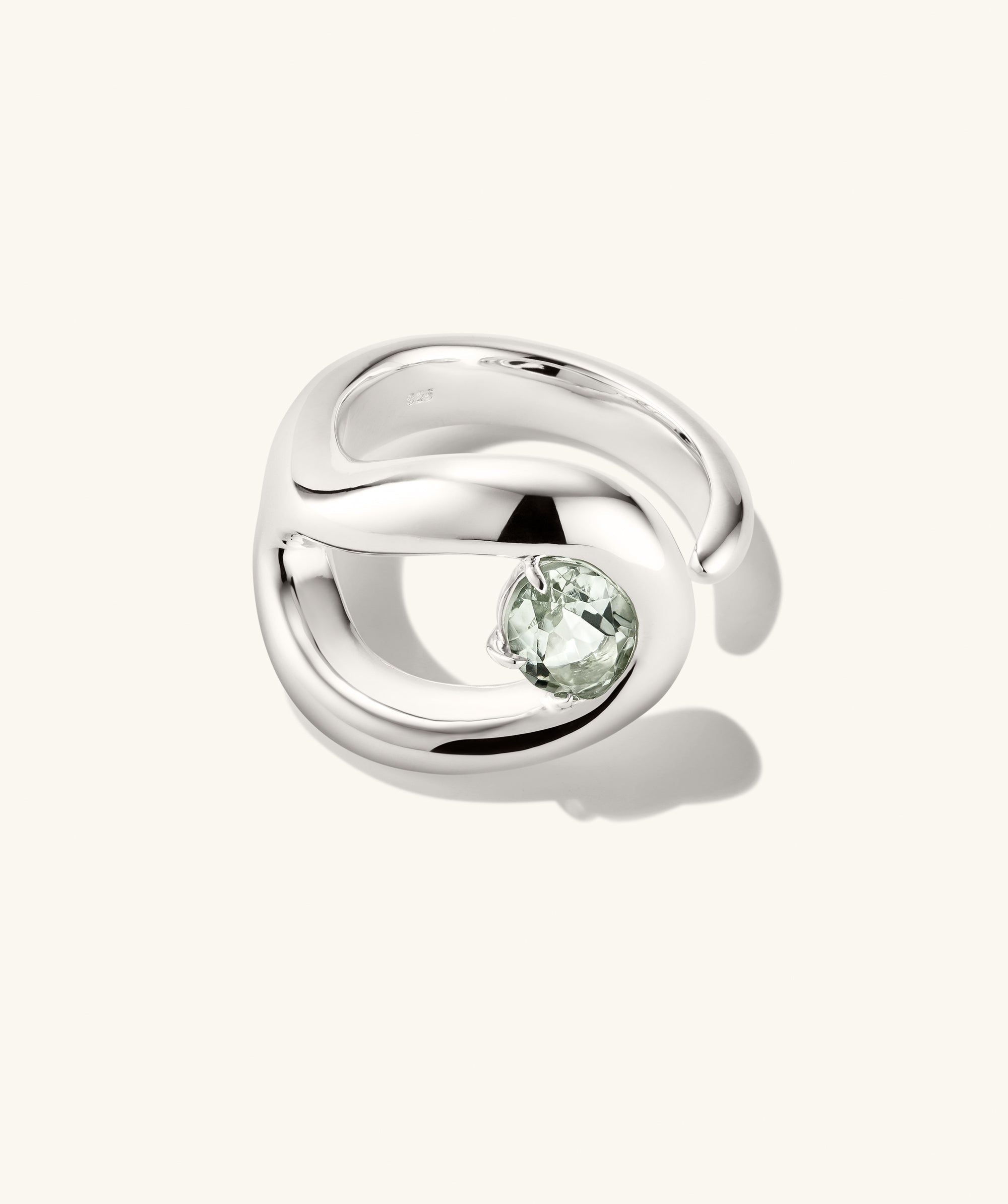 Organic DÃ´me Curve Gemstone Ring, featuring a silver band with a prominent green stone, showcasing organic curves and artistic negative space design.