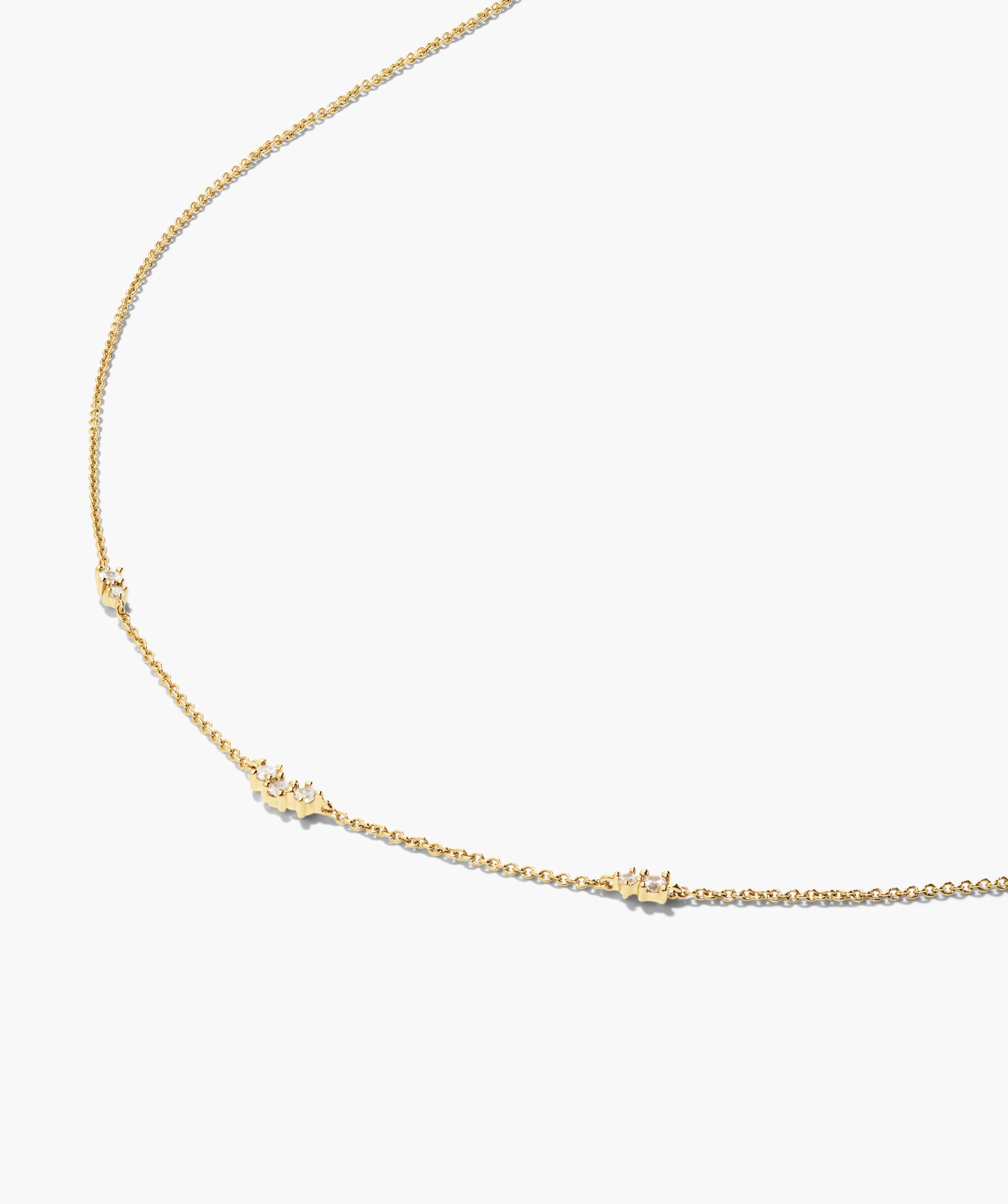 Floating Lab Grown Sapphire Necklace featuring a delicate yellow-gold chain with three diamond-studded bar segments, ideal for a minimalist, versatile accessory.