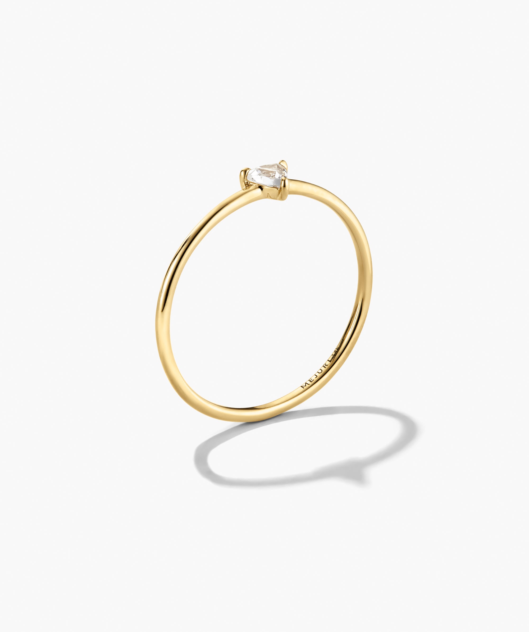 Gemstone Trillion Stacker Ring featuring a slender design in 14k gold with a pear-shaped white topaz in a minimalist solitaire setting.