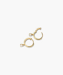 Round Lab Grown Sapphire Hoops featuring small yellow-gold huggies with a dangling clear round-cut stone, set in smooth, polished hoops.