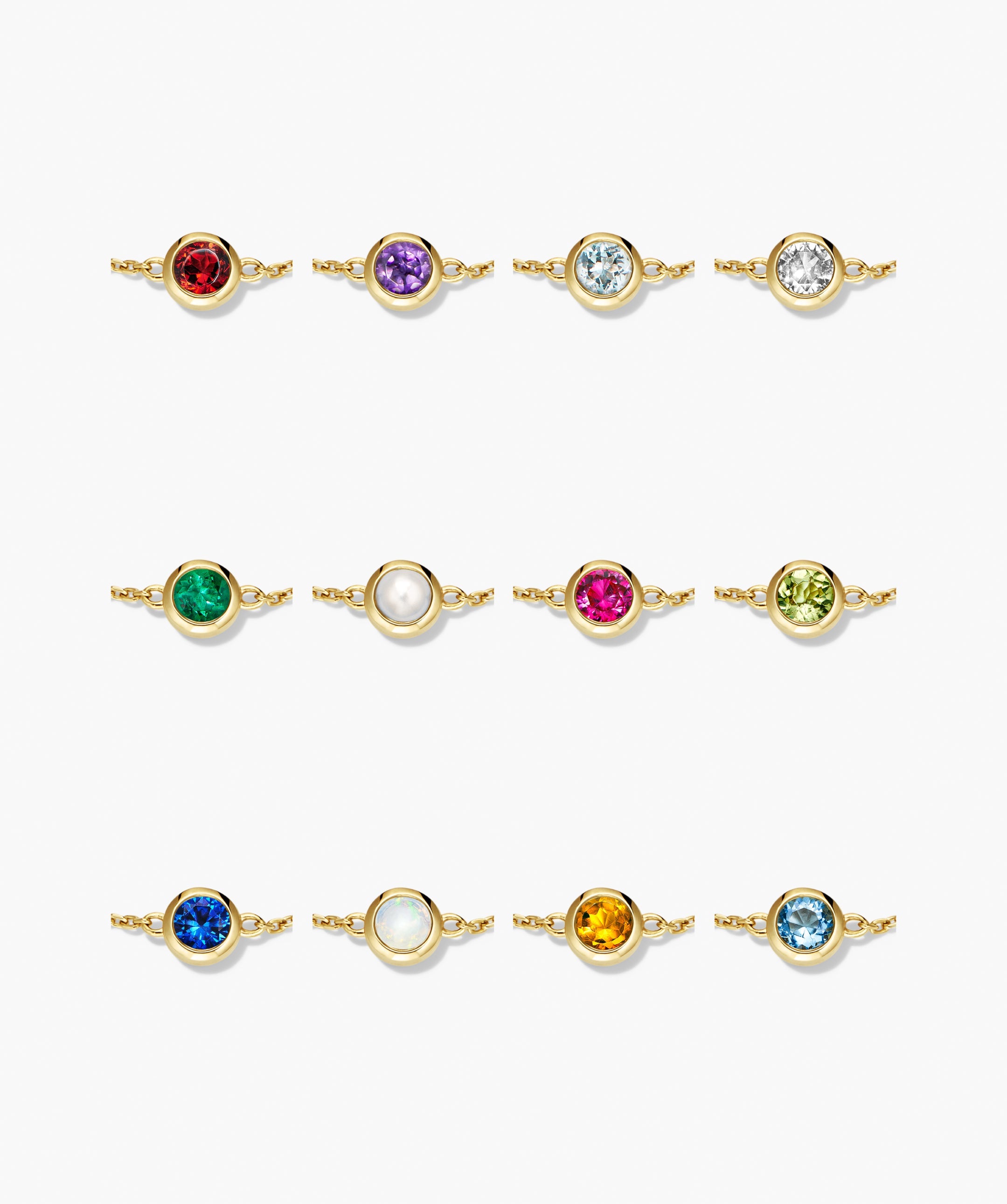 Sia Birthstone Bracelet features twelve bezel-set gemstones on gold chains, offering personalized elegance with vibrant stones like garnet, amethyst, and sapphire. Ideal for gifting or personal wear.