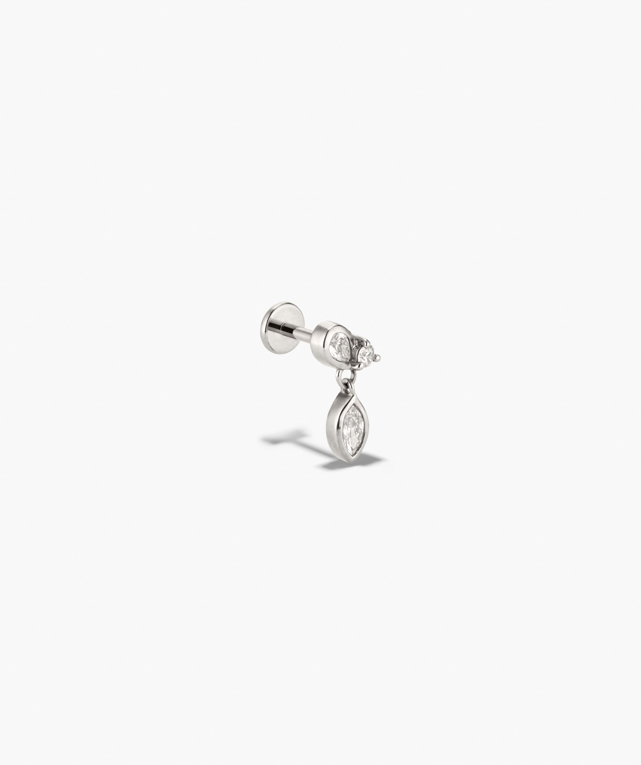 Piercing Studio - Lab Grown Diamond Drop Studs with a polished white metal stud, featuring a round diamond and a dangling bezel-set marquise-cut diamond.