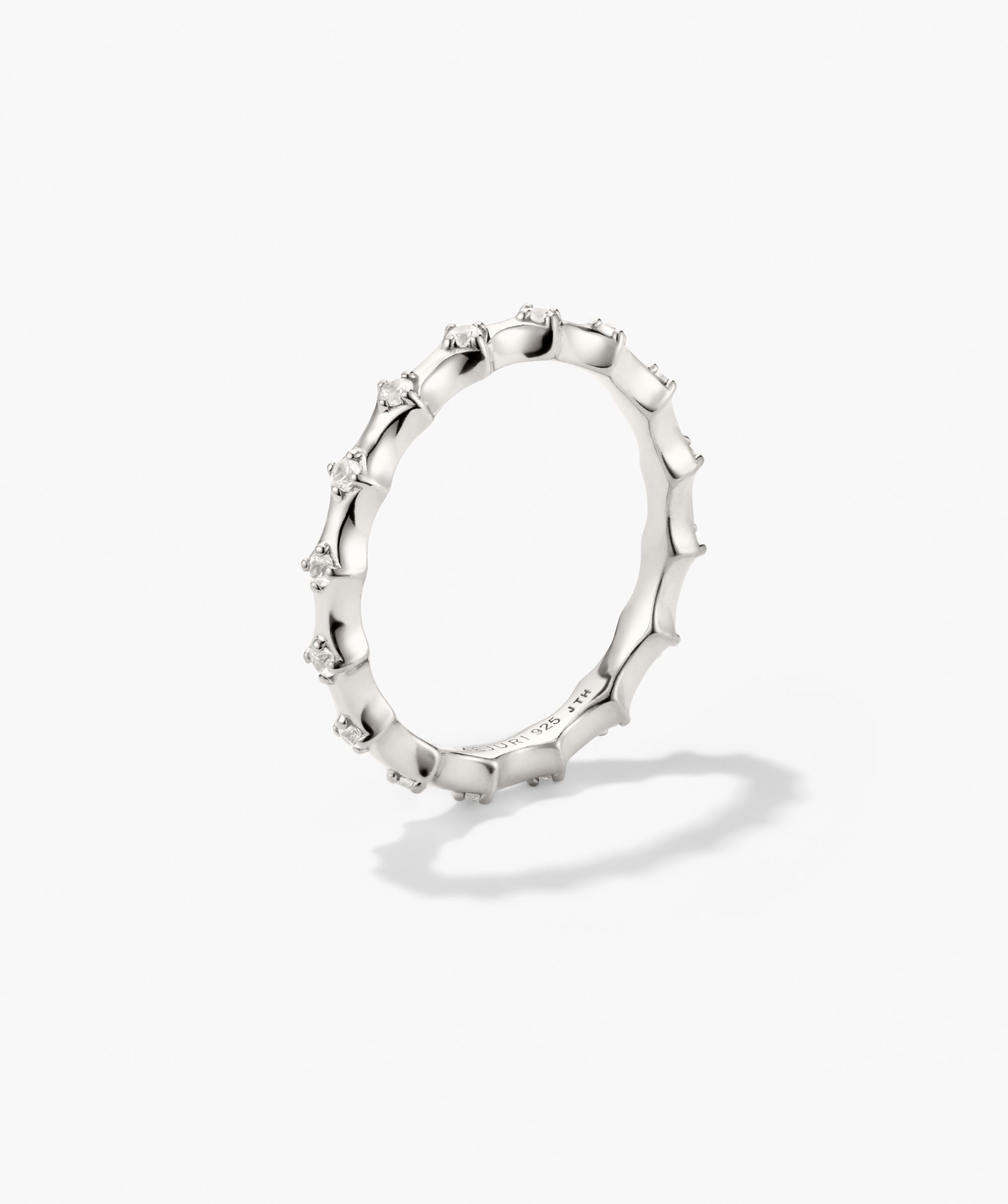 Charlotte Crest Stacker Ring: Sterling silver band with a bamboo texture, featuring evenly spaced tiny clear stones, ideal for stacking.