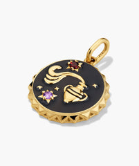 Cosmic Pendant Necklace featuring a gold-tone medallion with an Aquarius motif, black enamel face, and two gemstone starbursts, ideal for stacking.