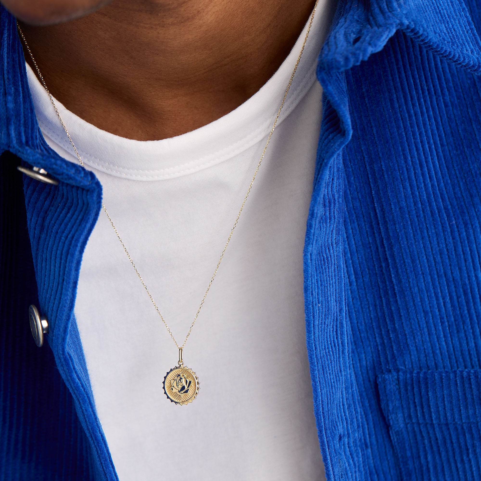 Person wearing a Strength: Rose Coin Charm Pendant, a handcrafted, recycled 14k solid gold necklace symbolizing strength and openness to new possibilities.