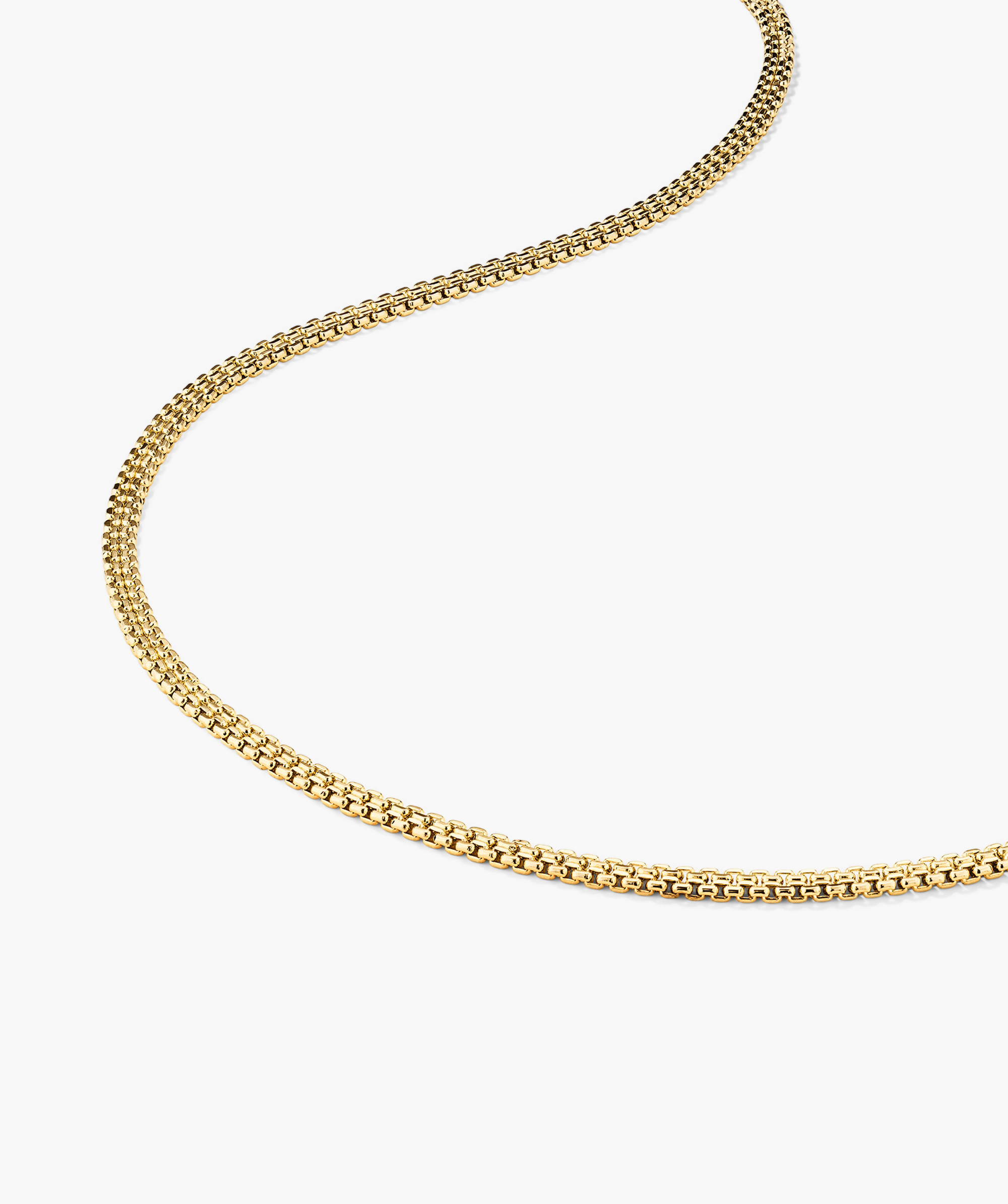 Timepiece Chain Necklace: Close-up of a 14k gold handcrafted chain, displayed on a white surface.