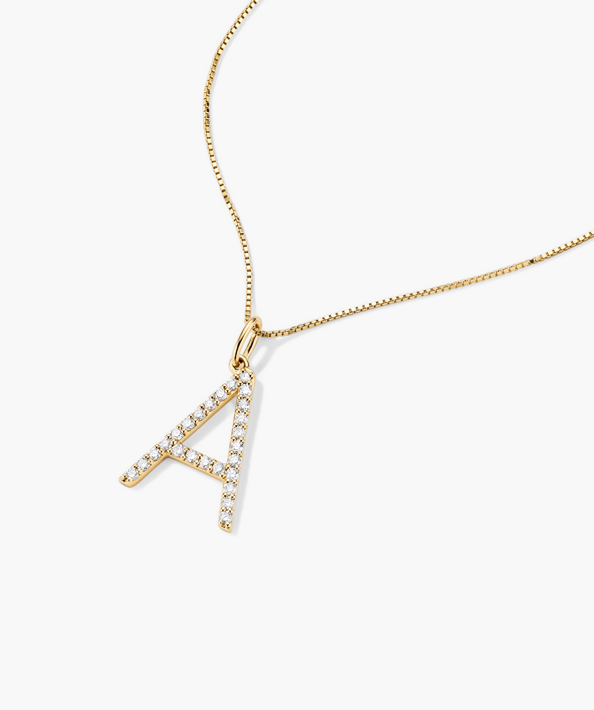 Gold necklace featuring a handcrafted 14k gold oversized letter charm adorned with lab-grown diamonds, emphasizing ethical and responsible production.