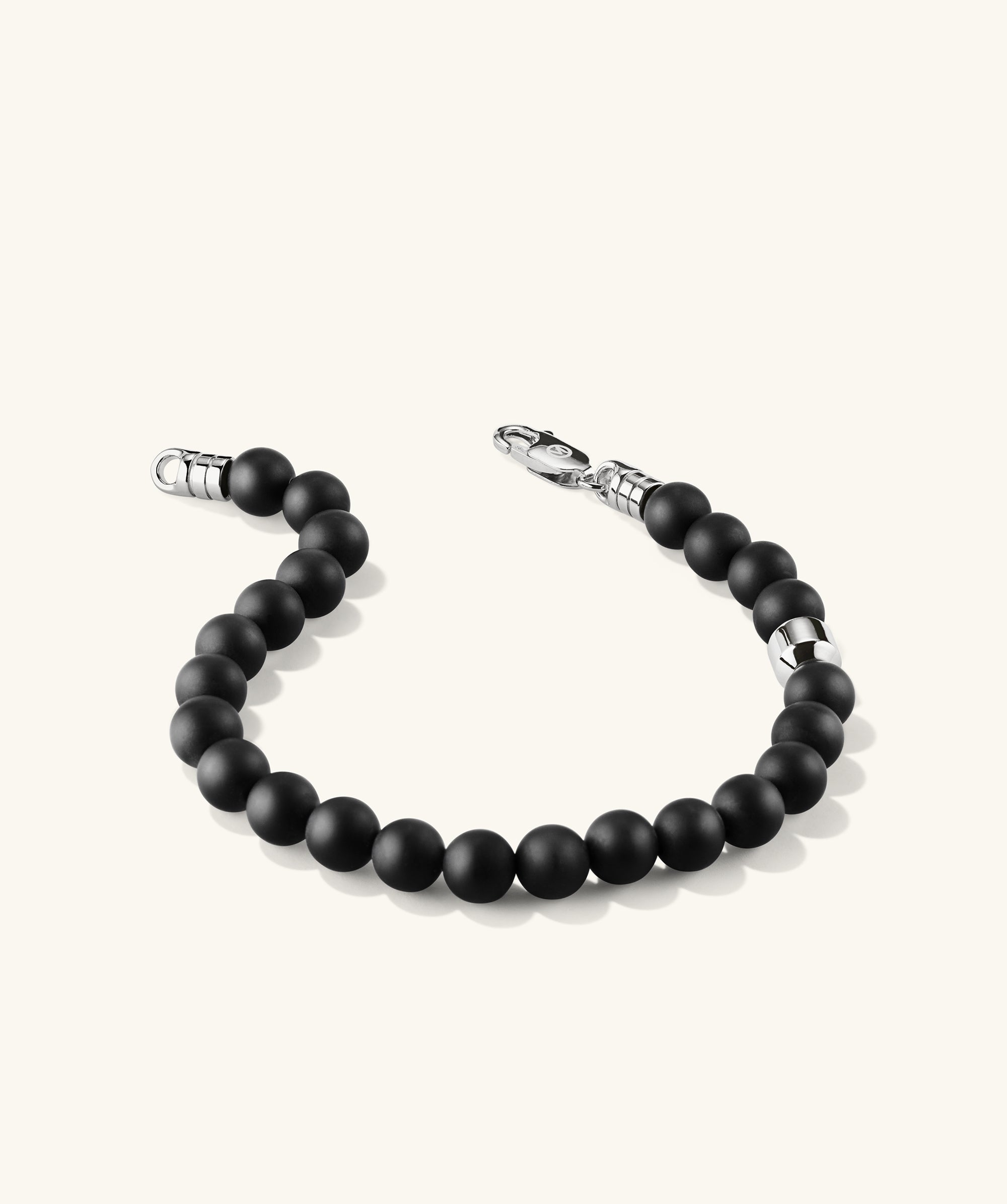 6mm Gemstone Beaded Bracelet: Handcrafted in sterling silver with a swivel clasp, featuring black beads for added texture and shape.