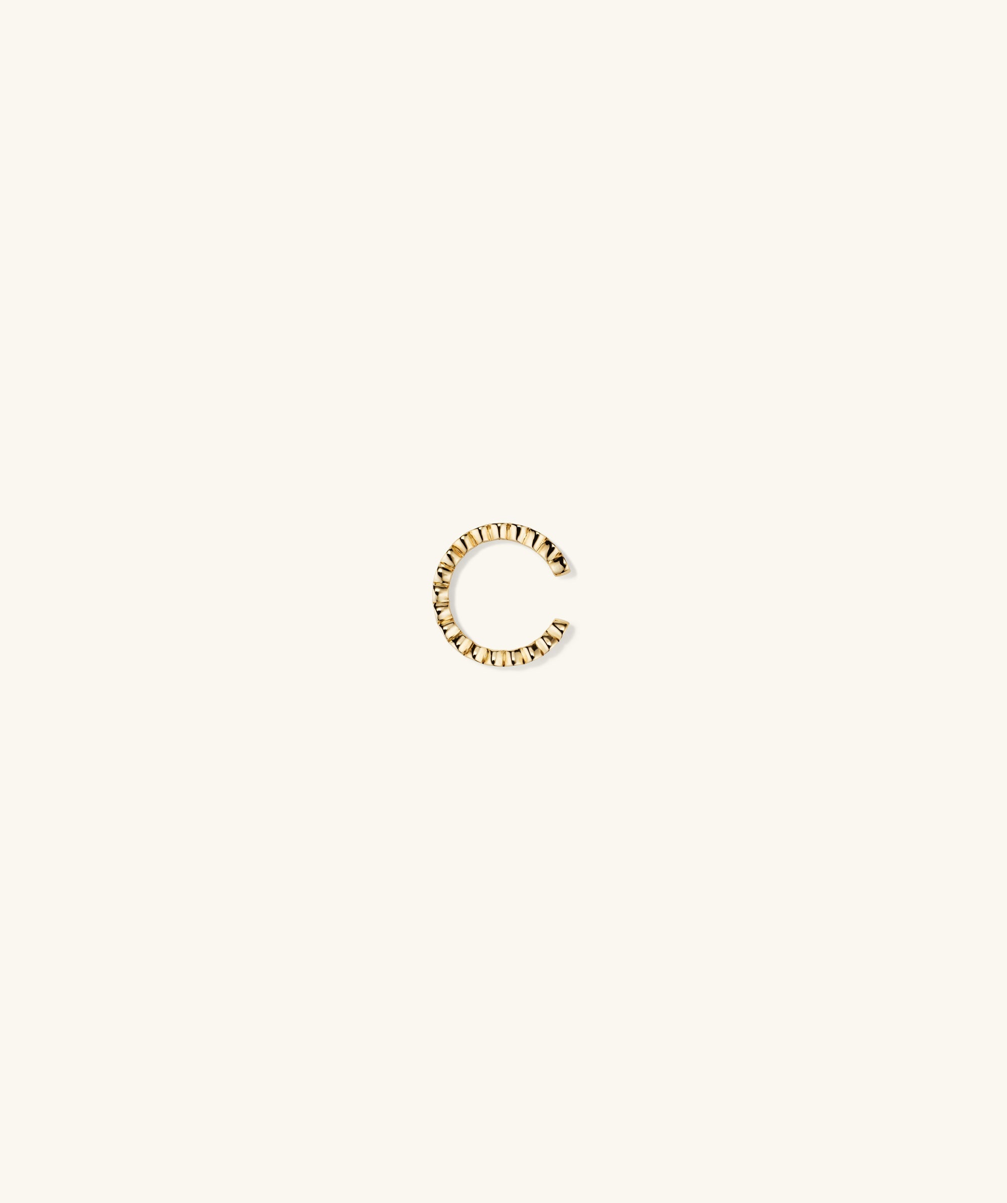 Diamond Ear Cuff showcasing a gold 'C' shape, adorned with responsibly sourced diamonds, designed for easy wear without piercing. Handcrafted in 14k solid gold.