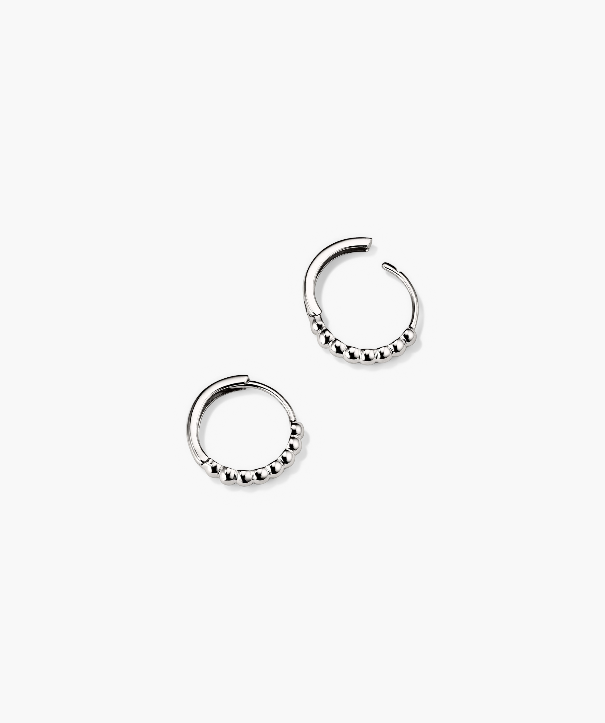 Beaded Huggie Hoops: a pair of silver hoop earrings with intricate beaded detailing, handcrafted in recycled 14k solid gold.