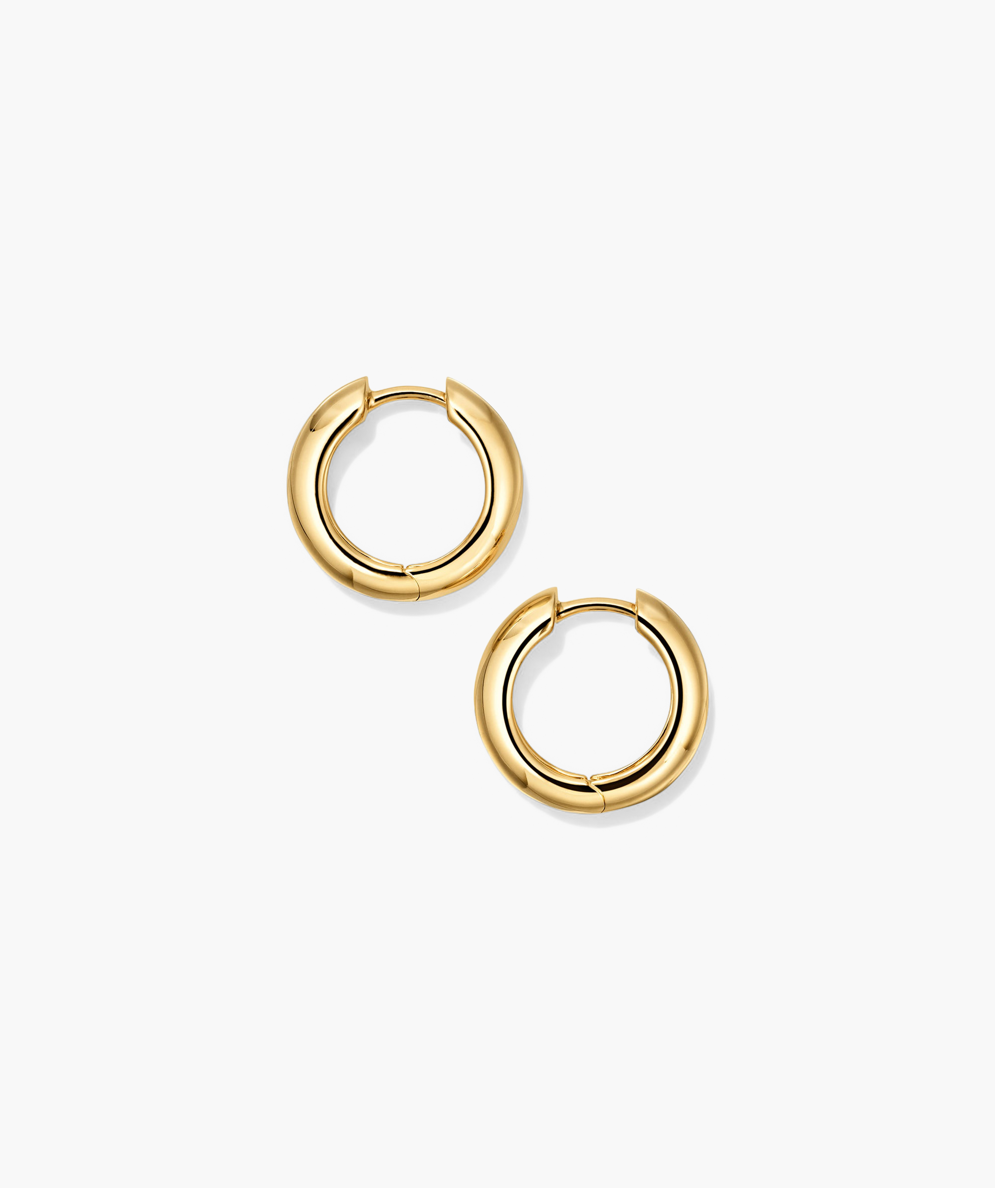 Plush Small Hoops: a pair of handcrafted 14k gold hoop earrings with a pillowy design.