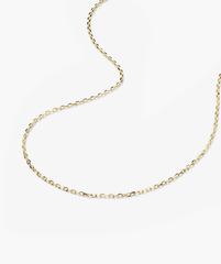 Gold Chain Necklace on a white surface, ideal for adding charms or layering with other necklaces and chokers.