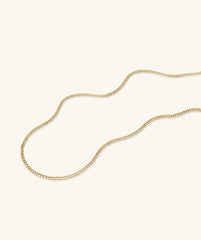 Curb Chain Necklace, 14k solid gold, displayed on a white surface. Handcrafted for daily wear, this shorter chain complements longer necklaces perfectly.