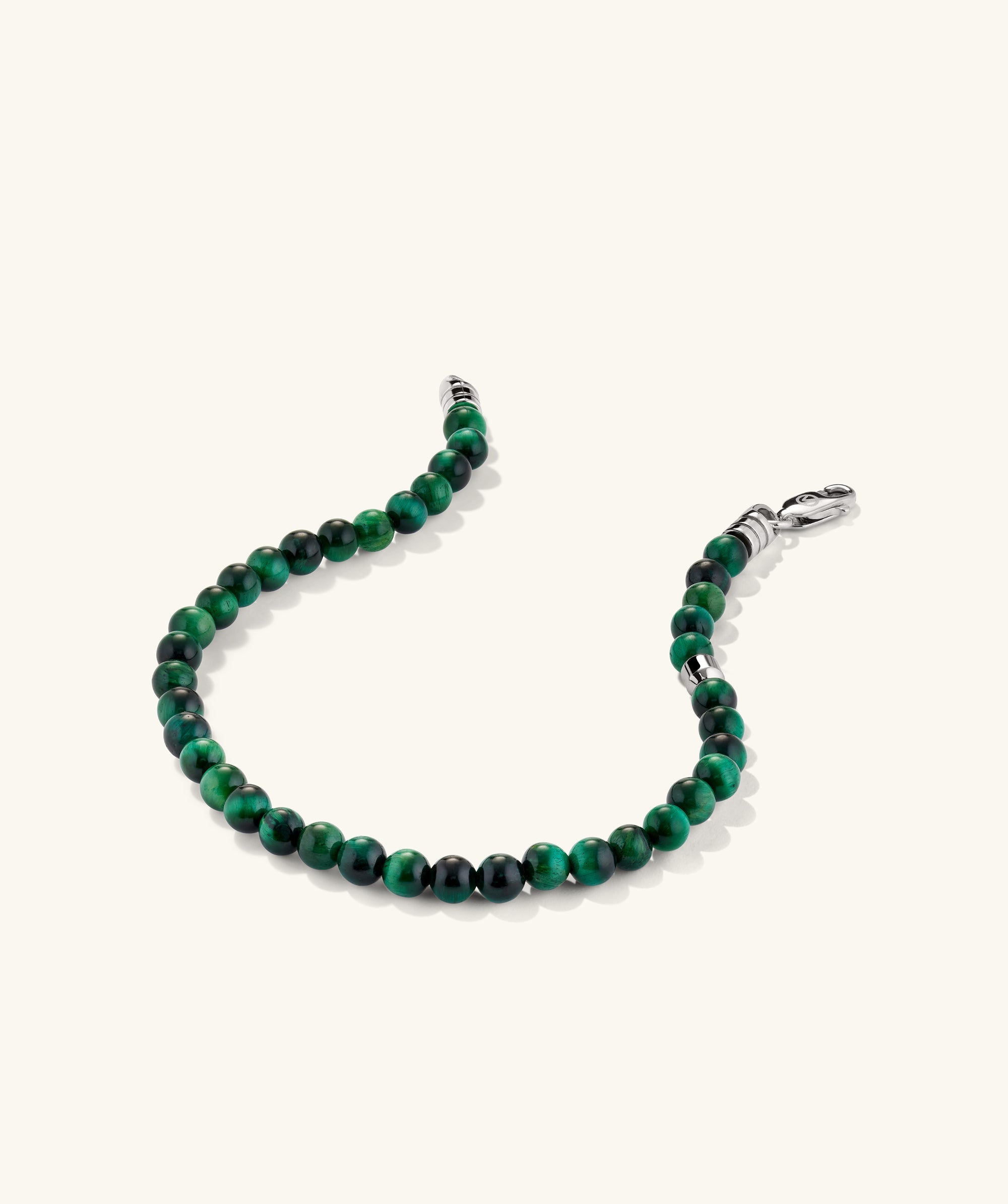 Green and black beaded bracelet featuring 4mm gemstones, handcrafted in sterling silver with a swivel clasp.