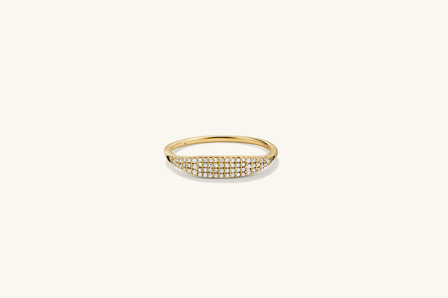 PavÃ© Diamond Slim Signet: A gold ring adorned with diamonds, offering a refined and elegant accessory with significant visual impact.