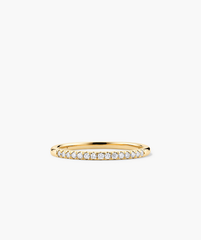 Gold ring with diamonds, named Diamonds Team Ring, shown in close-up view. Elegant design, perfect for stacking and enhancing any outfit.