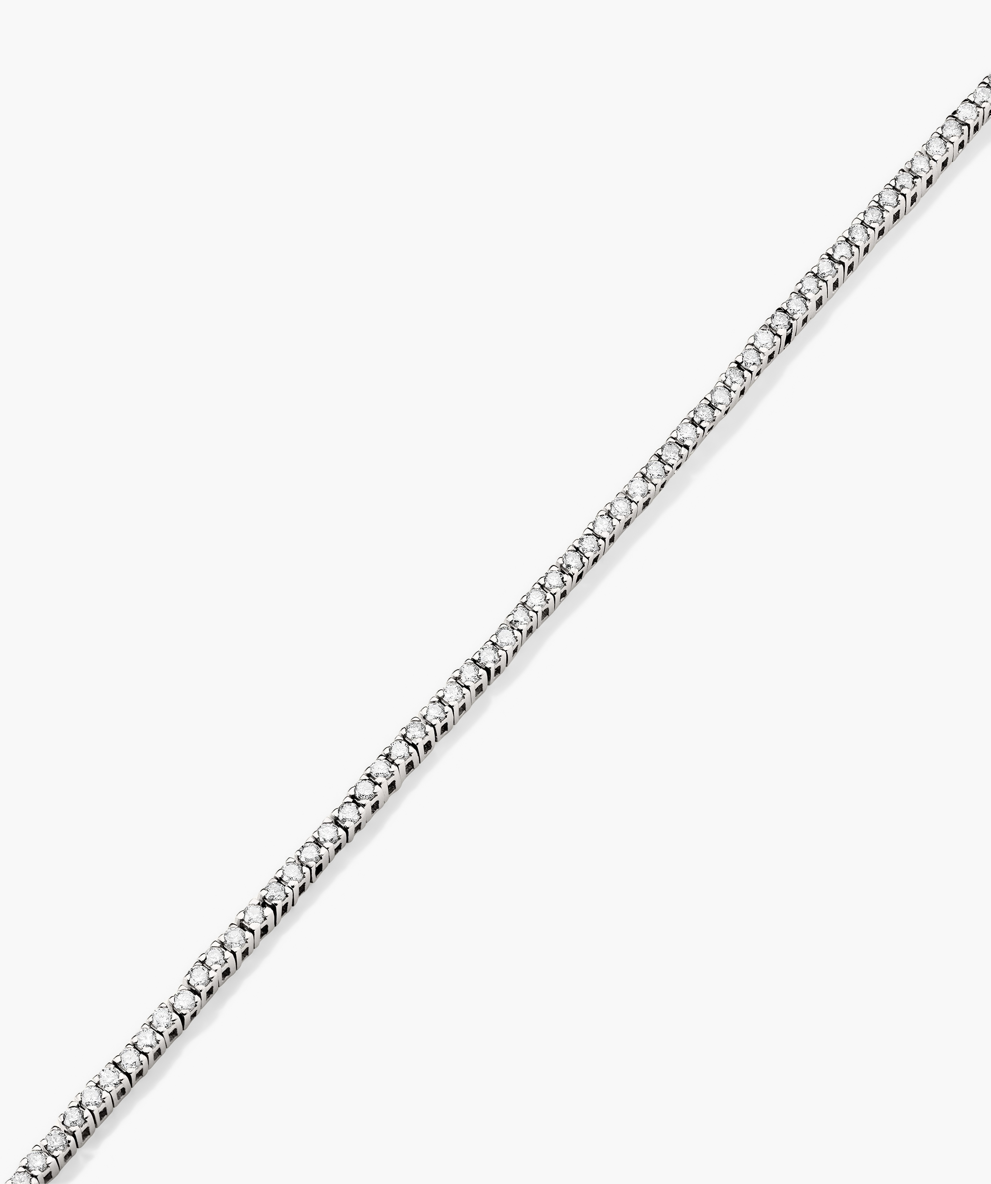Diamond Tennis Bracelet 1.3mm: A silver bracelet adorned with diamonds, handcrafted in 14k solid gold, featuring a secure clasp with safety arms.