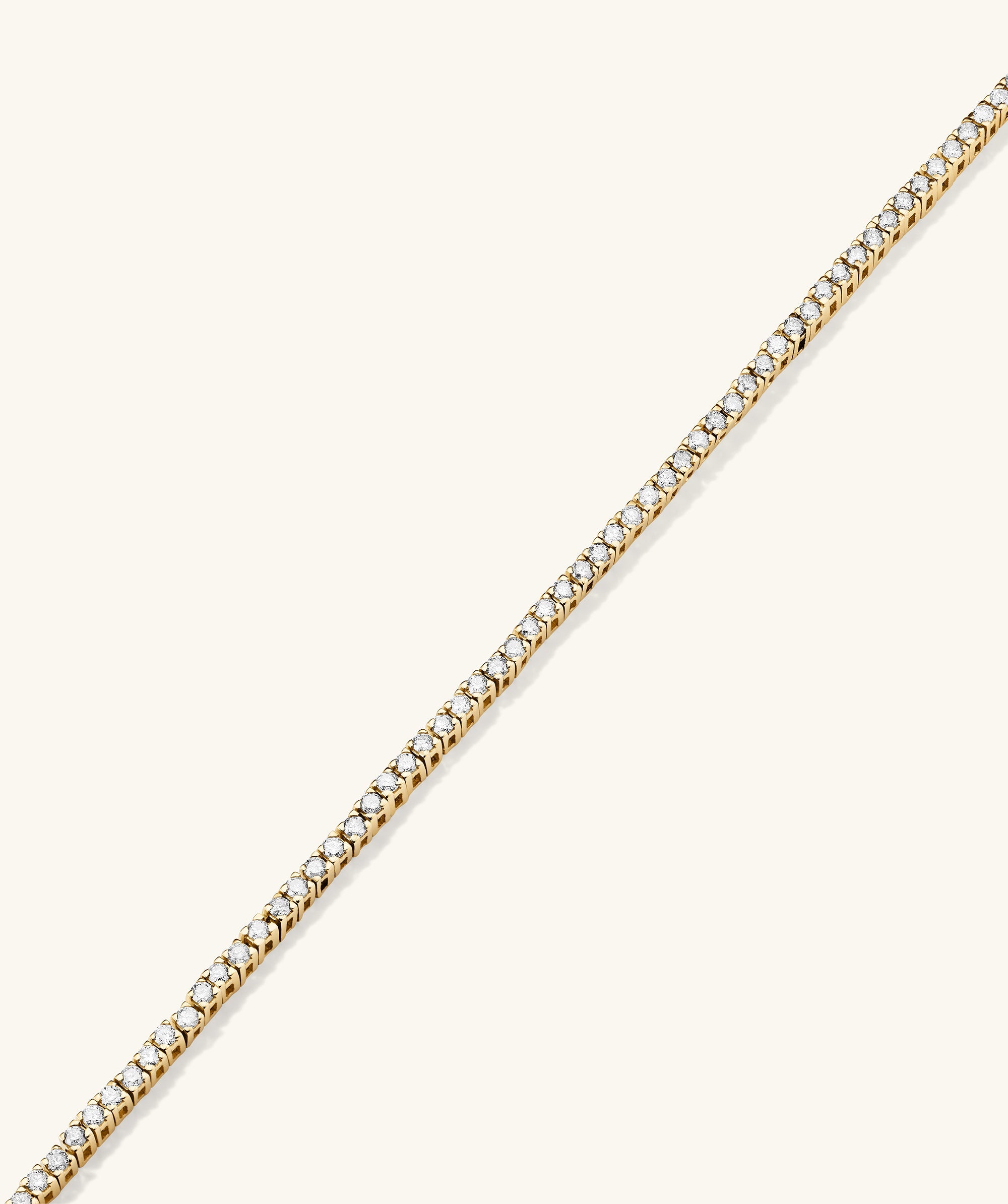 Diamond Tennis Bracelet 1.3mm: Handcrafted 14k gold bracelet featuring a delicate chain adorned with responsibly sourced diamonds, secured by a clasp with safety arms.