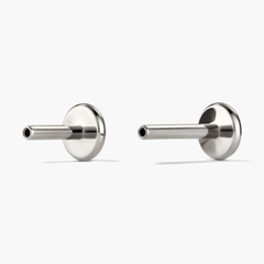 Diamond Mini Stud earrings in a prong setting, featuring miniature diamonds; designed for stacking, with flat backs for comfort and two post sizes for a perfect fit.
