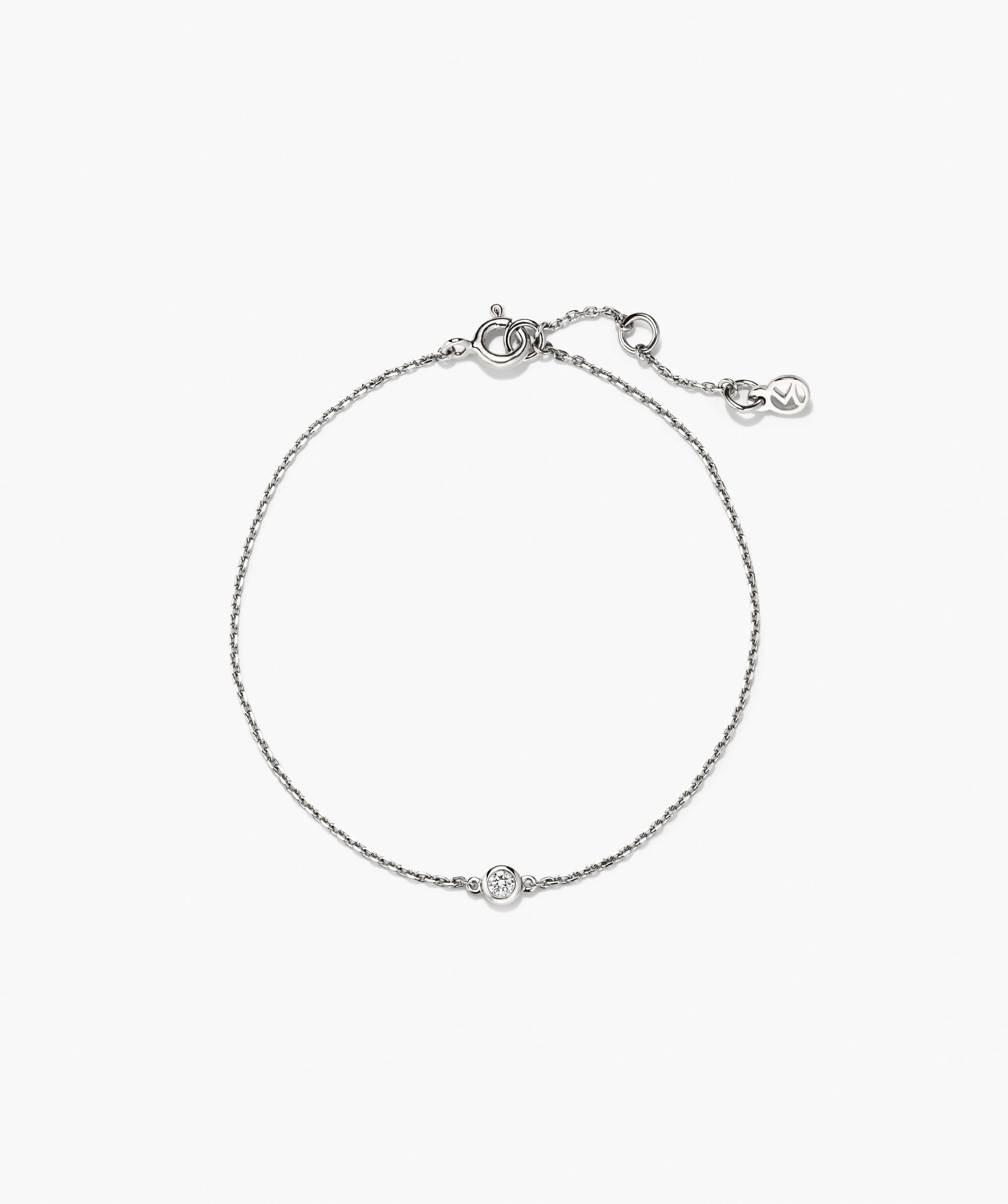 Solo Lab Grown Sapphire Bracelet with a delicate silvery chain, featuring a bezel-set clear stone and spring-ring clasp with extender and branded tag.