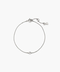 Solo Lab Grown Sapphire Bracelet with a delicate silvery chain, featuring a bezel-set clear stone and spring-ring clasp with extender and branded tag.