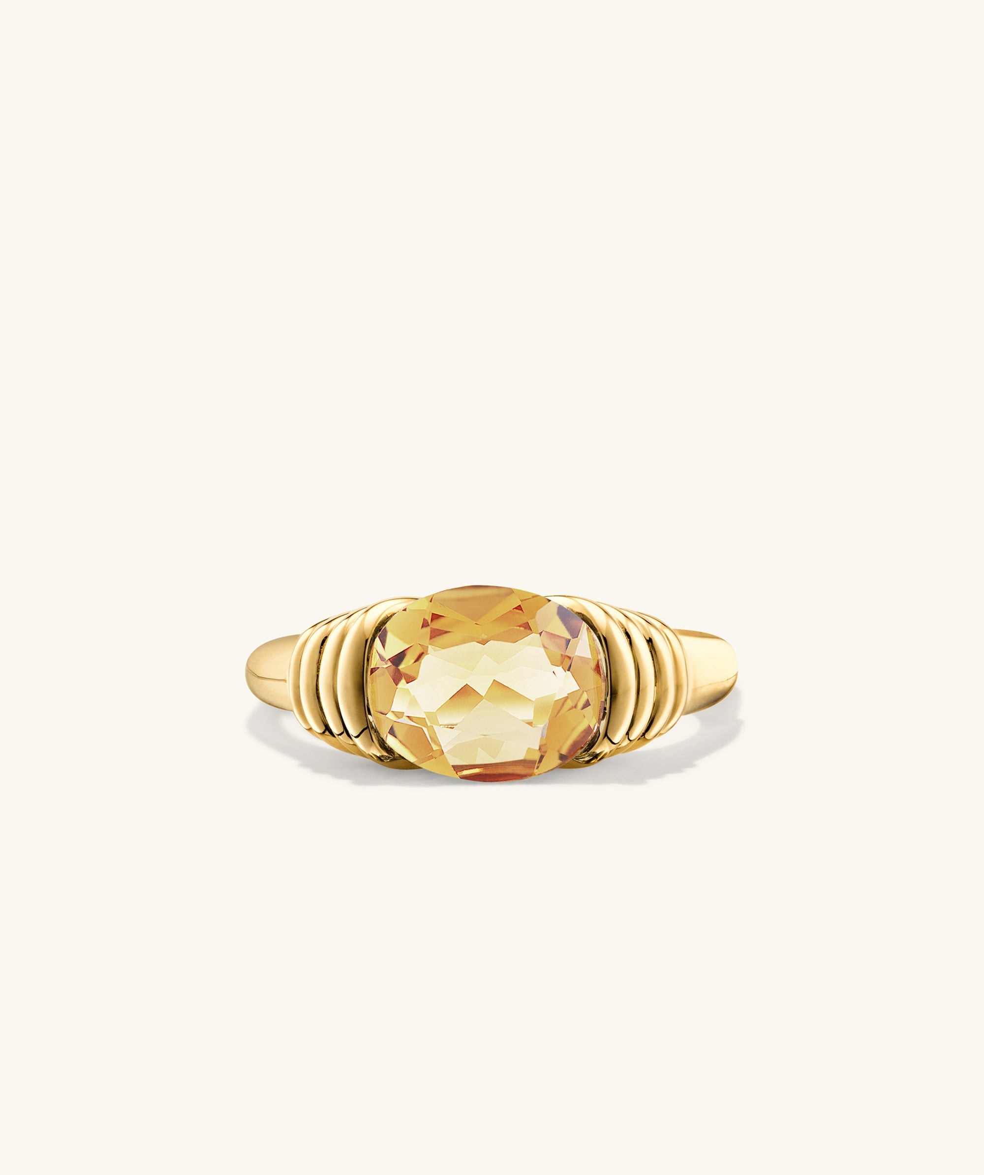 Heirloom Ring: Close-up of an intricately designed ring with a prominent yellow gem, symbolizing timeless elegance and destined for heirloom status.
