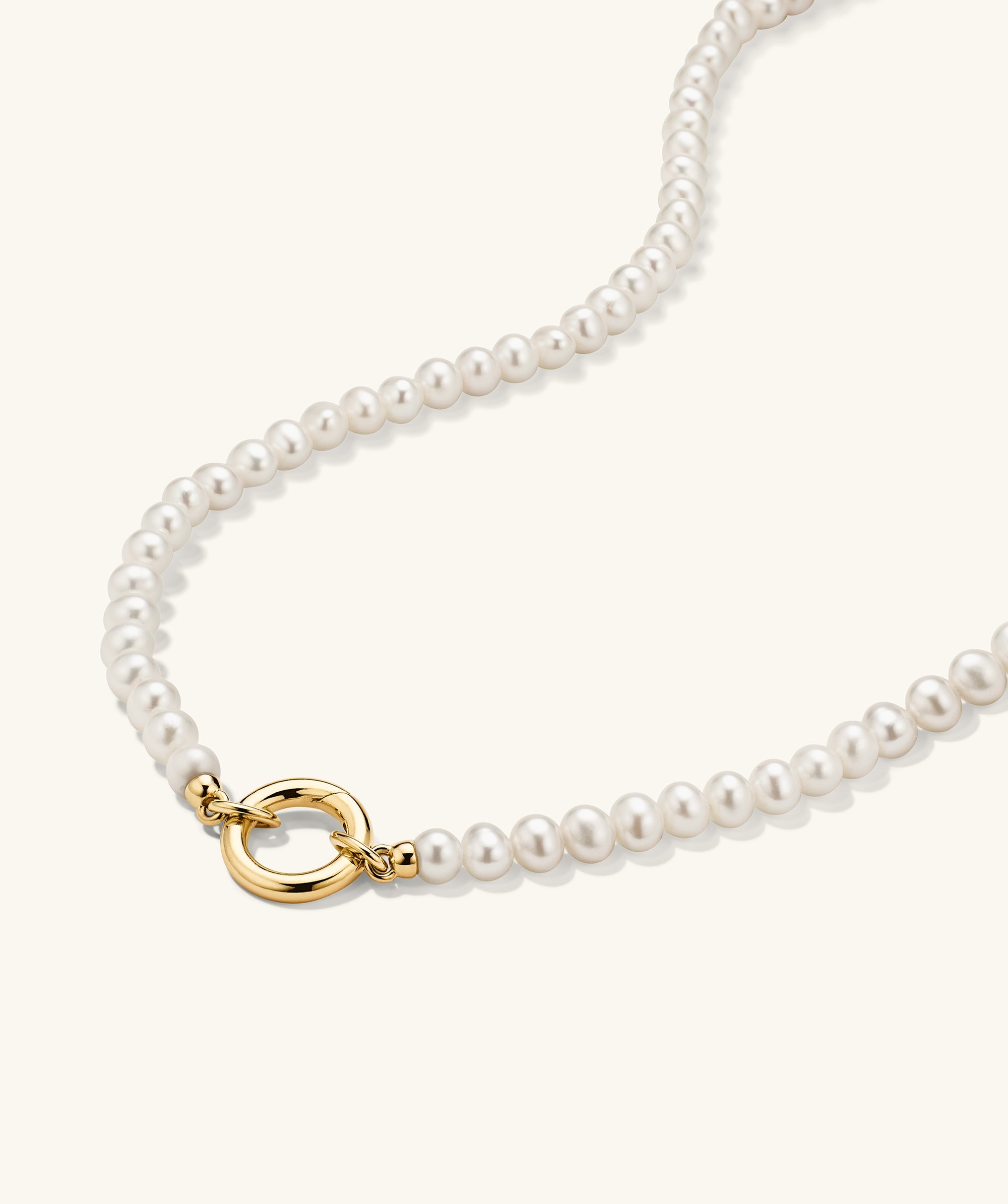 Pearl Necklace With Vermeil Enhancer featuring an 18k gold vermeil ring and freshwater pearls, perfect for customizable charm additions, ideal for year-round wear.