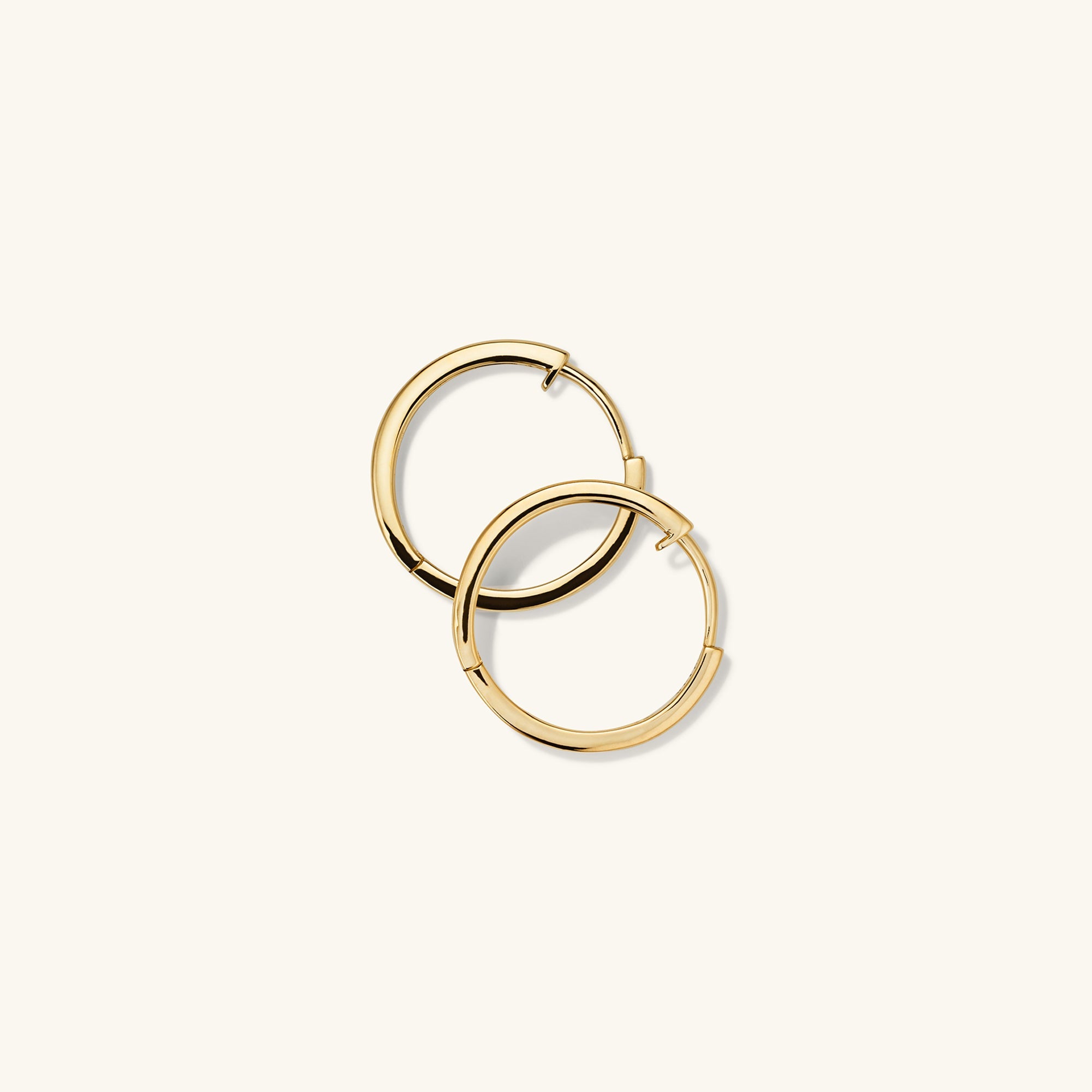 Easy Small Hoops: Handcrafted 14k gold hollow hoop earrings with a clicker closure, designed for everyday comfort and effortless wear.