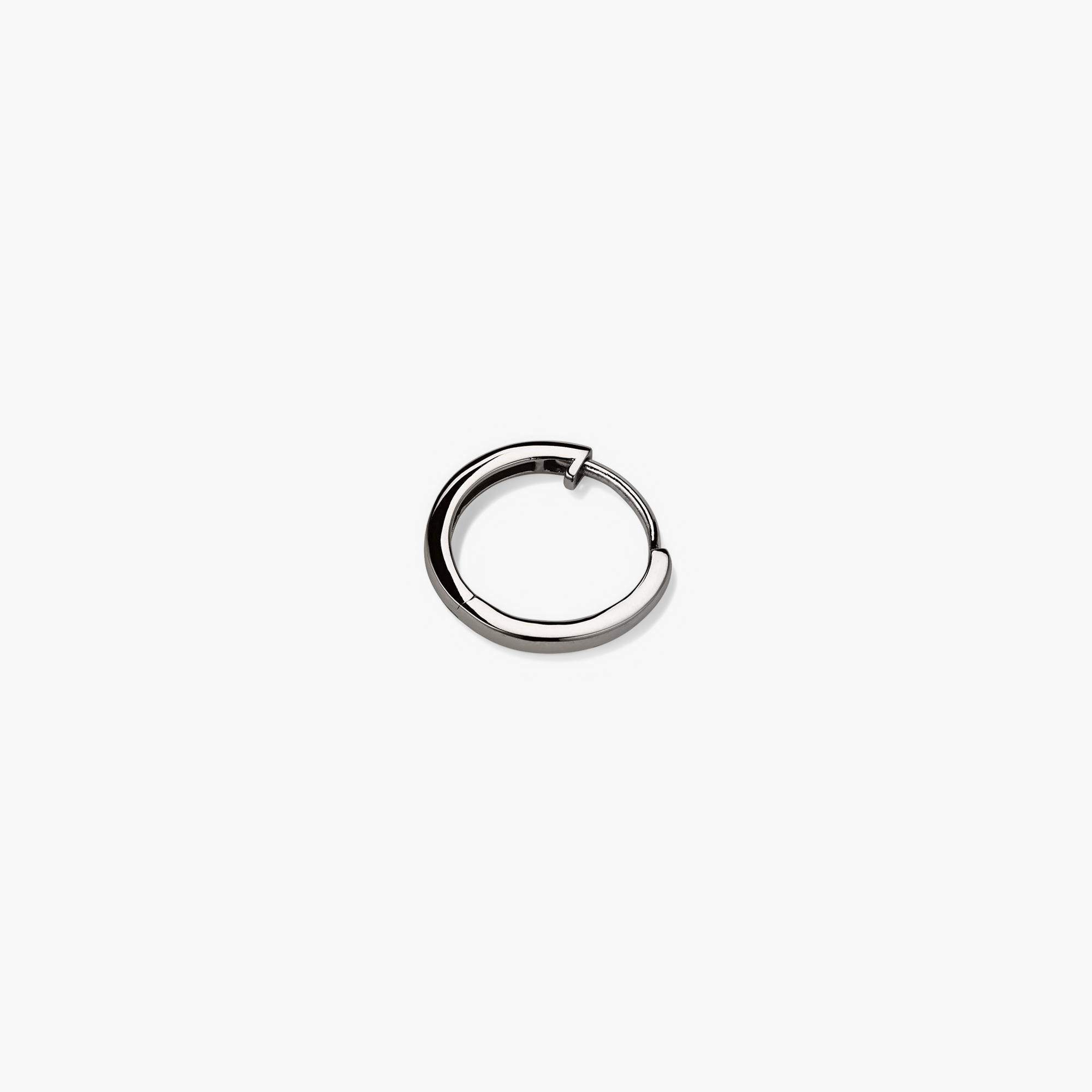 Close-up of the Single Easy Huggie Hoop, a handcrafted 14k gold ring with a clicker closure for comfort and security.