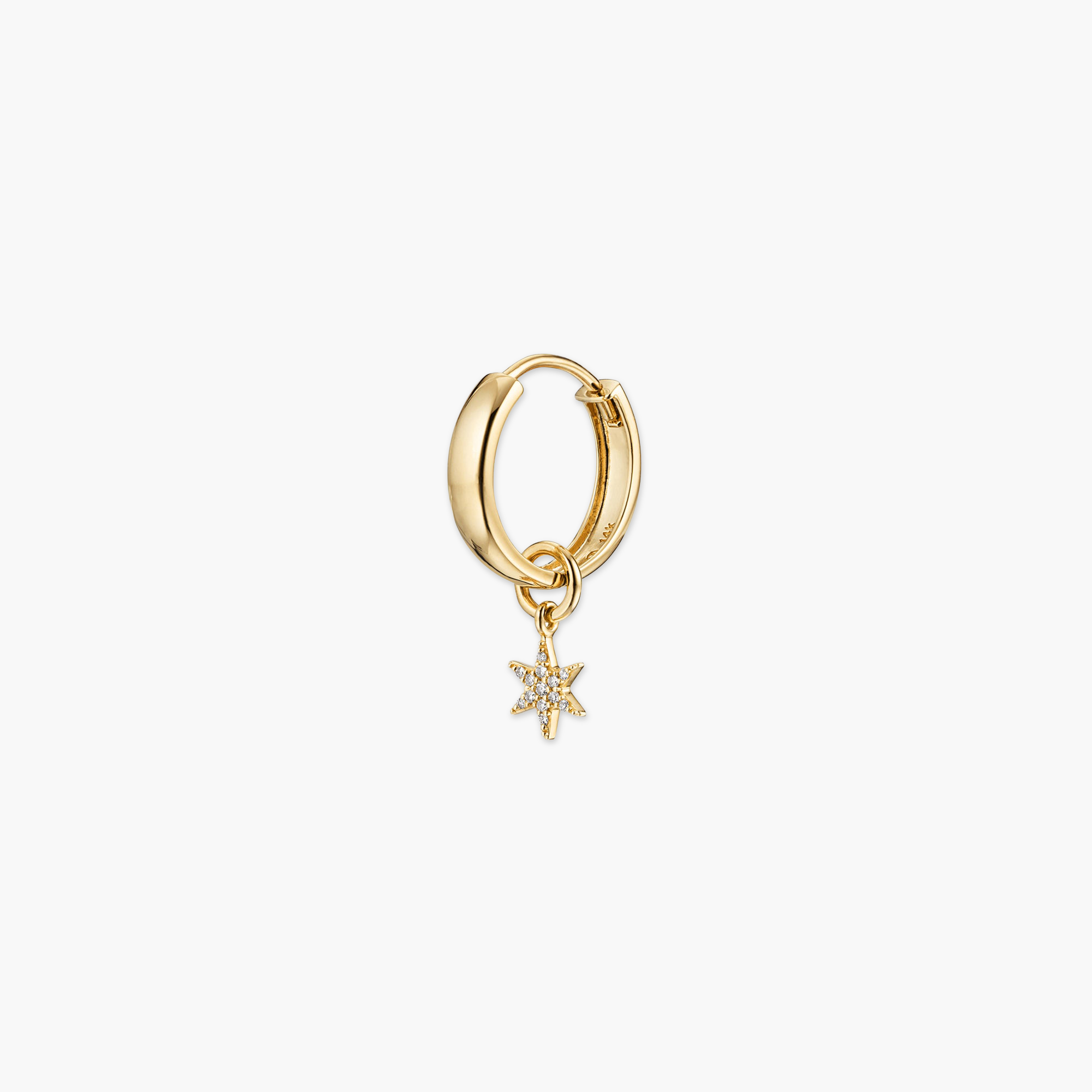 Gold hoop earring with a single pavÃ© diamond star charm, perfect for personalizing your eardrobe with a high-impact, versatile look.