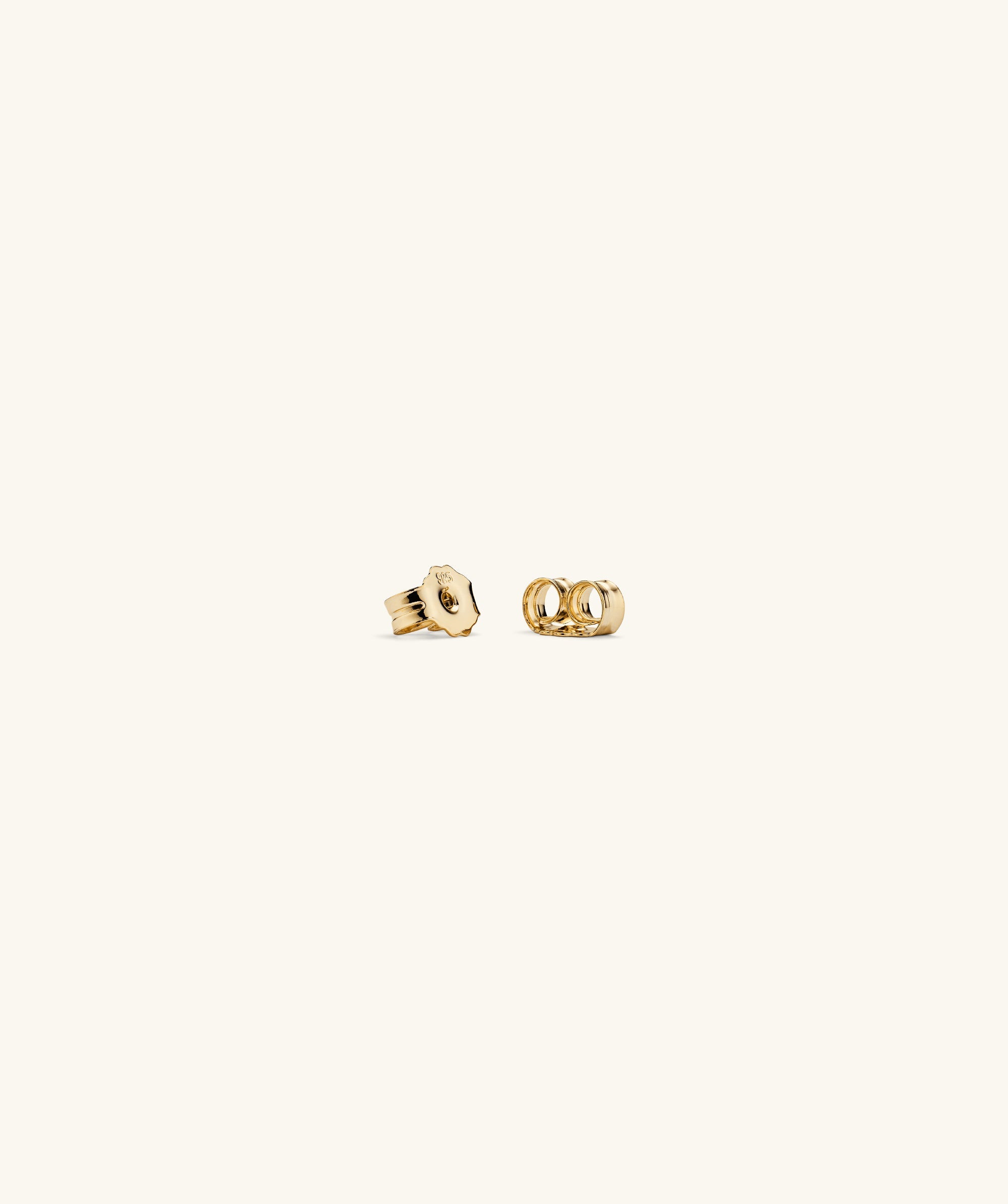 Puffy Charlotte Hoops: A pair of bold, gold earrings designed to make a statement, part of the Charlotte Collection.