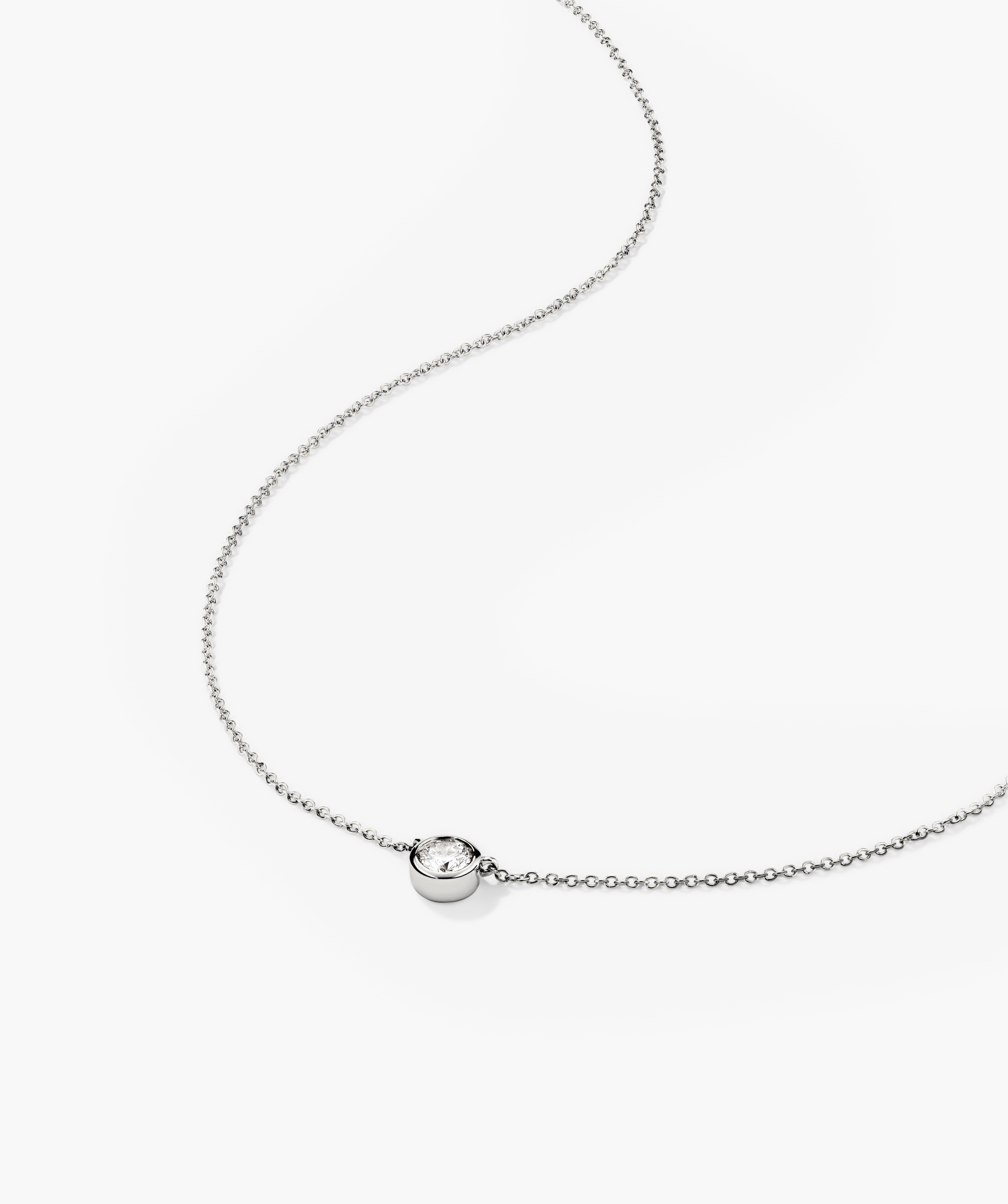 Bezel Lab Grown Diamond Necklace featuring a small diamond in the center, set in 14k solid gold.