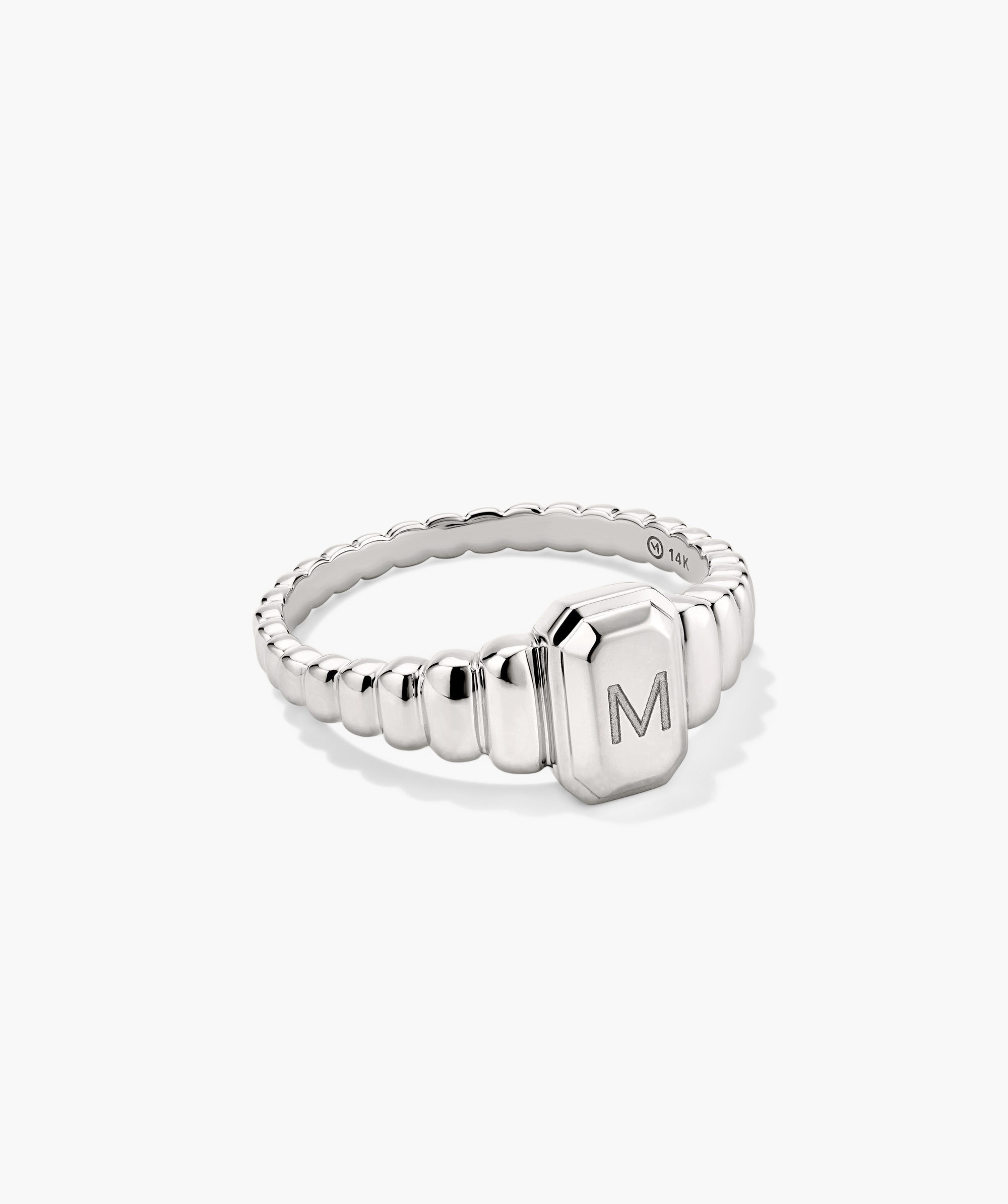 Charlotte Step Cut Signet Ring featuring a silver finish with an engravable letter, offering a textured design ideal for making a fashion statement.