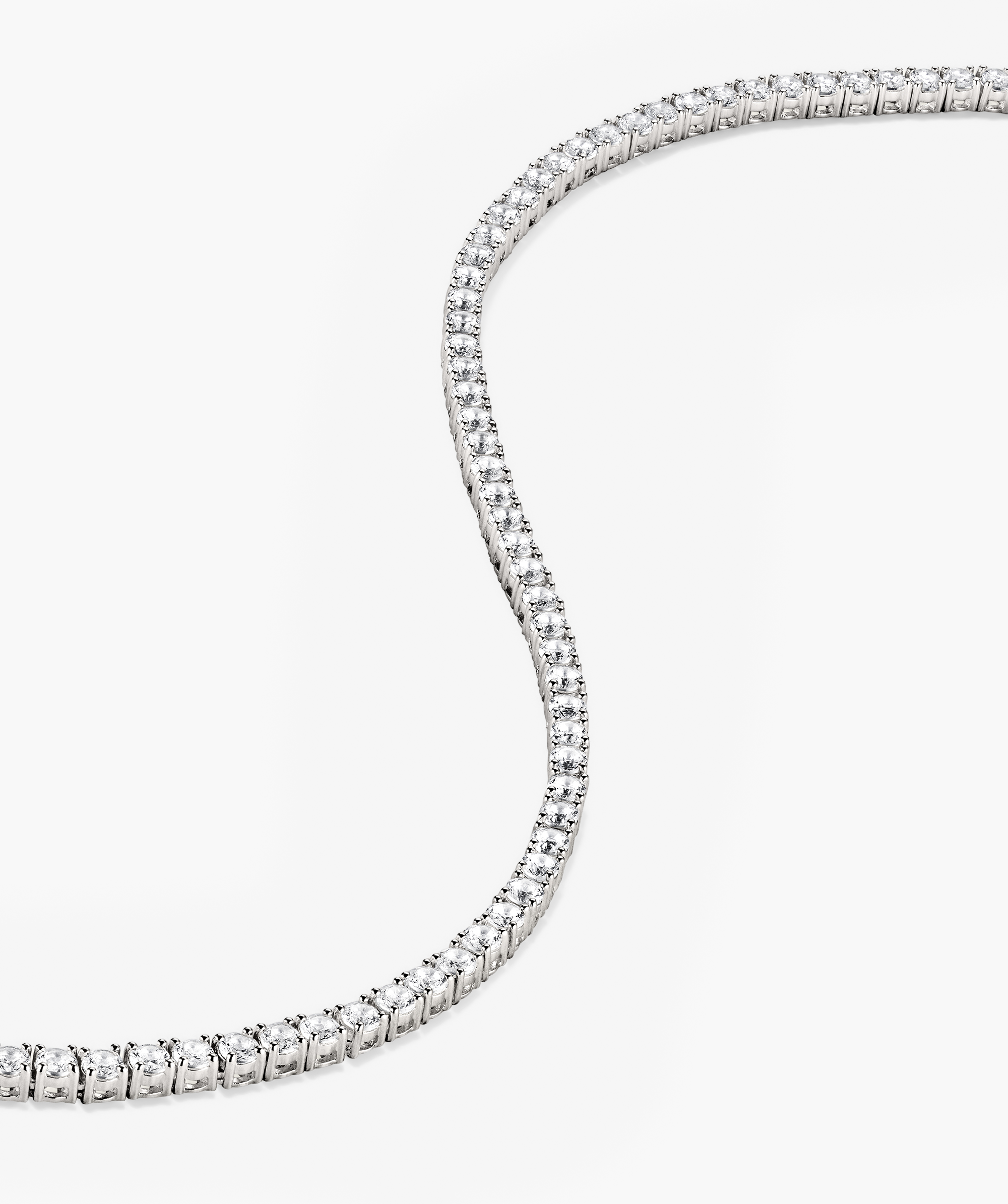 Close-up of the Lab Grown Sapphire Tennis Necklace in sterling silver, showcasing its sparkling lab-grown sapphires and secure clasp mechanism.