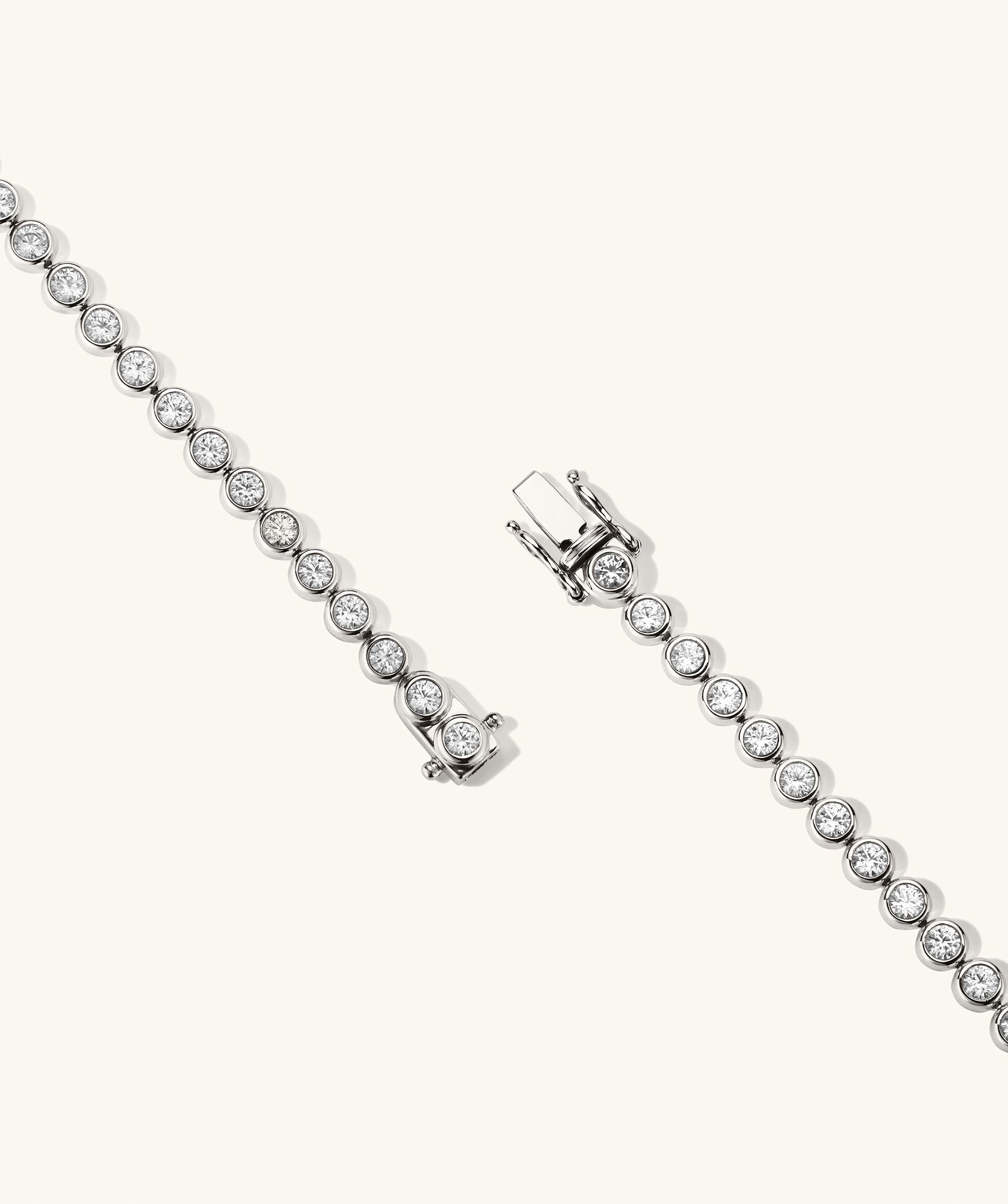 Zadie Bezel Lab Grown Sapphire Tennis Bracelet, featuring a pair of diamond-accented bracelets in bezel setting, showcasing intricate diamond details.