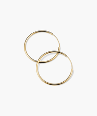 Large Hoops, delicately handcrafted in hollowed 14k solid gold, designed for everyday wear, displayed on a simple white background.