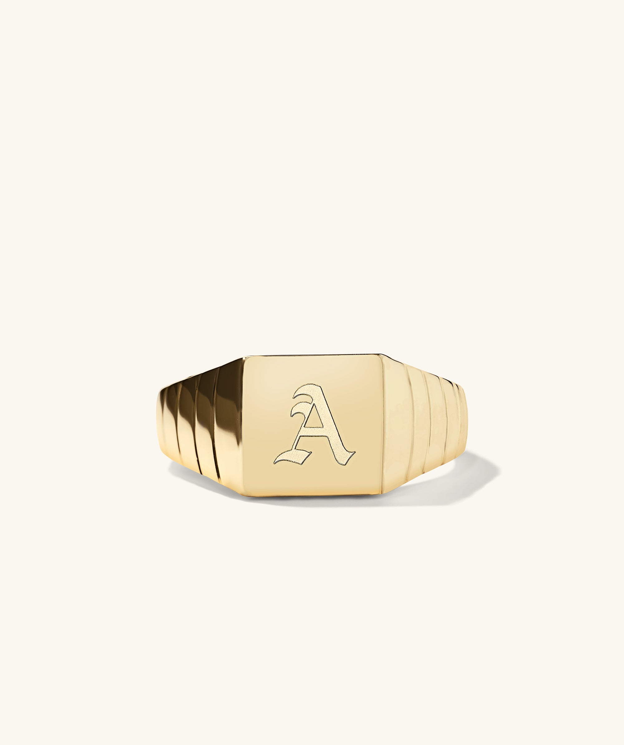 Square Signet Ring featuring a prominent letter engraved on the gold face, designed for a bold addition to your jewelry collection.