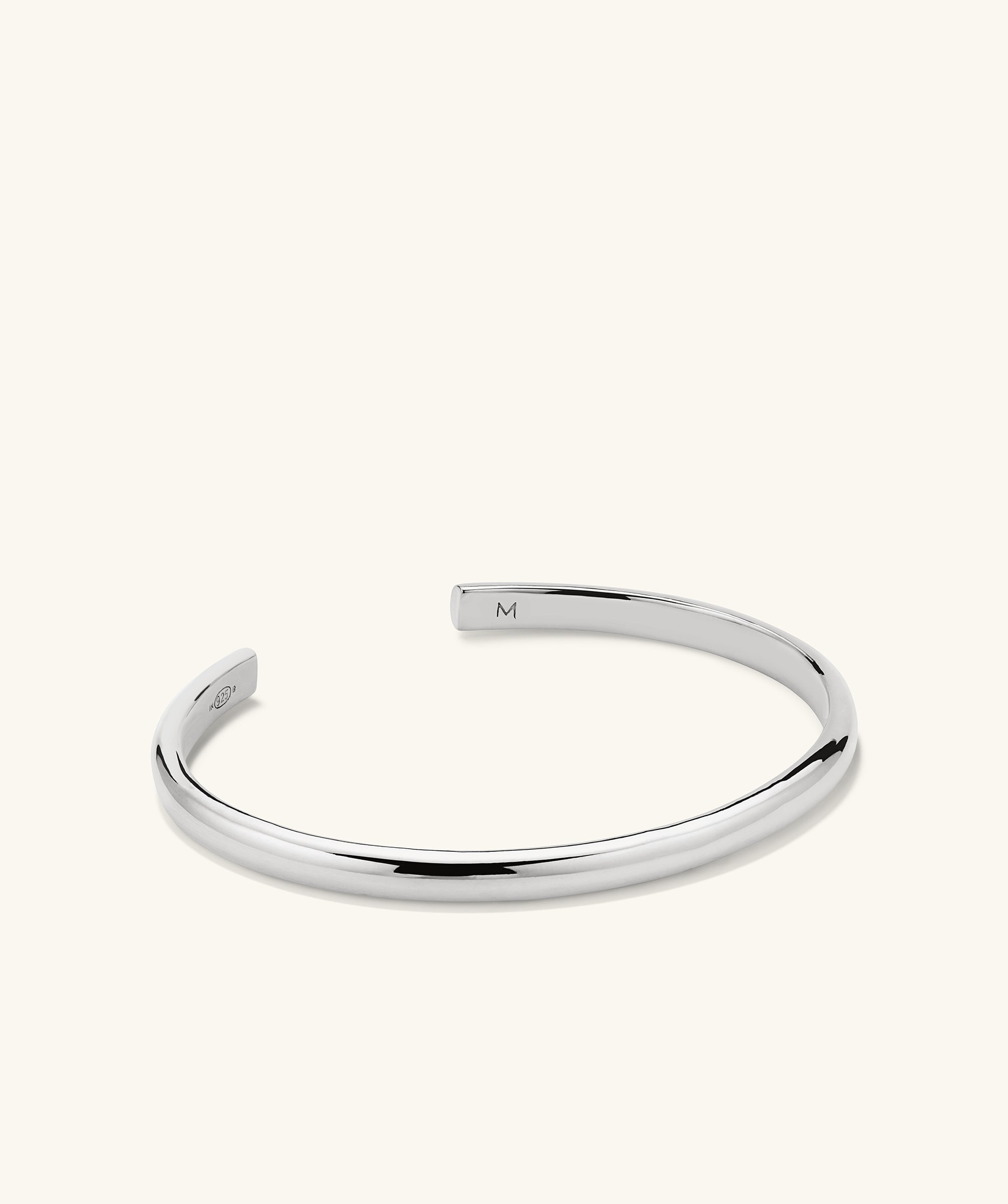 Slim Cuff: A silver bracelet featuring a sleek, minimalist design, perfect for versatile styling.