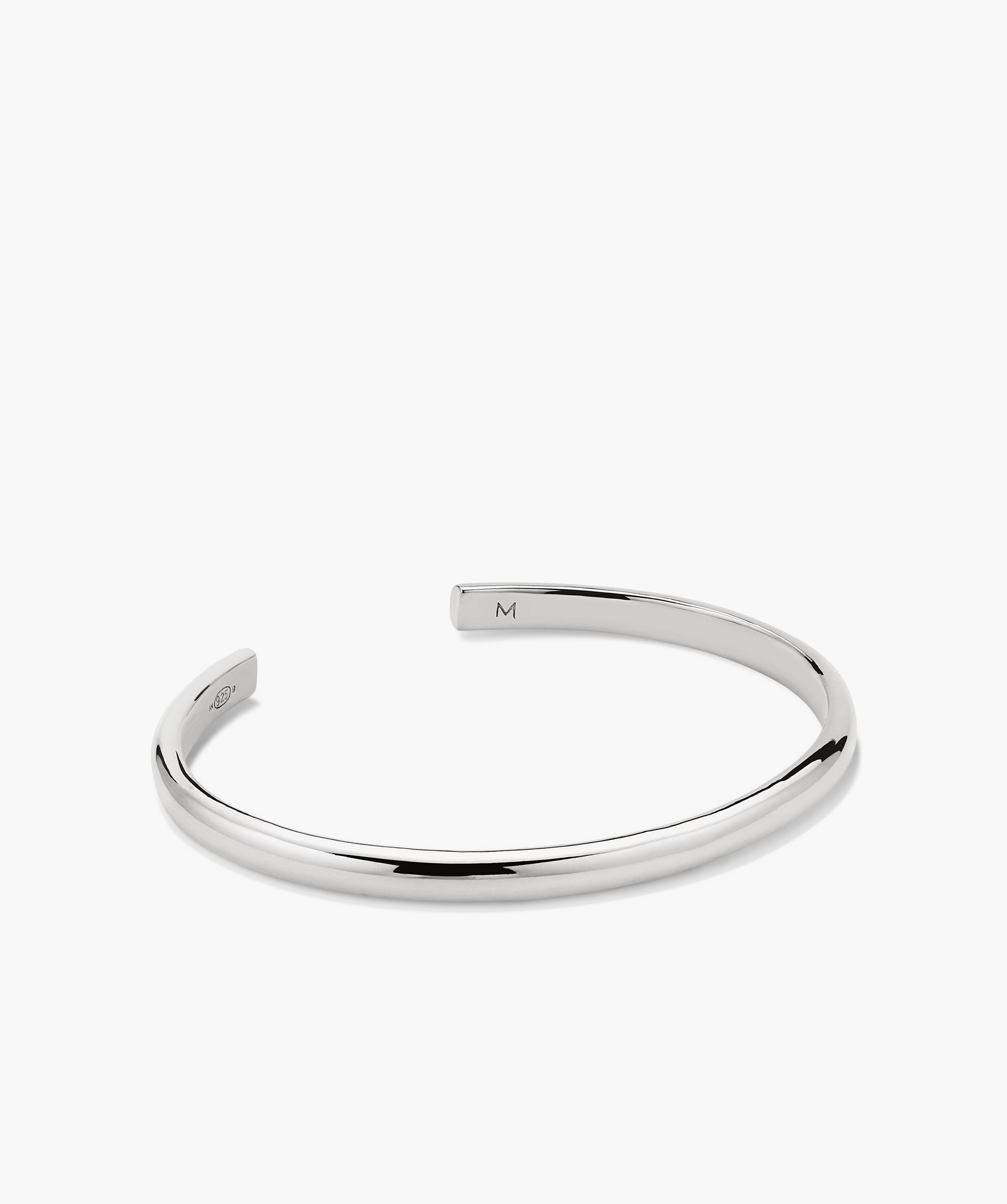Slim Cuff: A silver bracelet featuring a sleek, minimalist design, perfect for versatile styling.