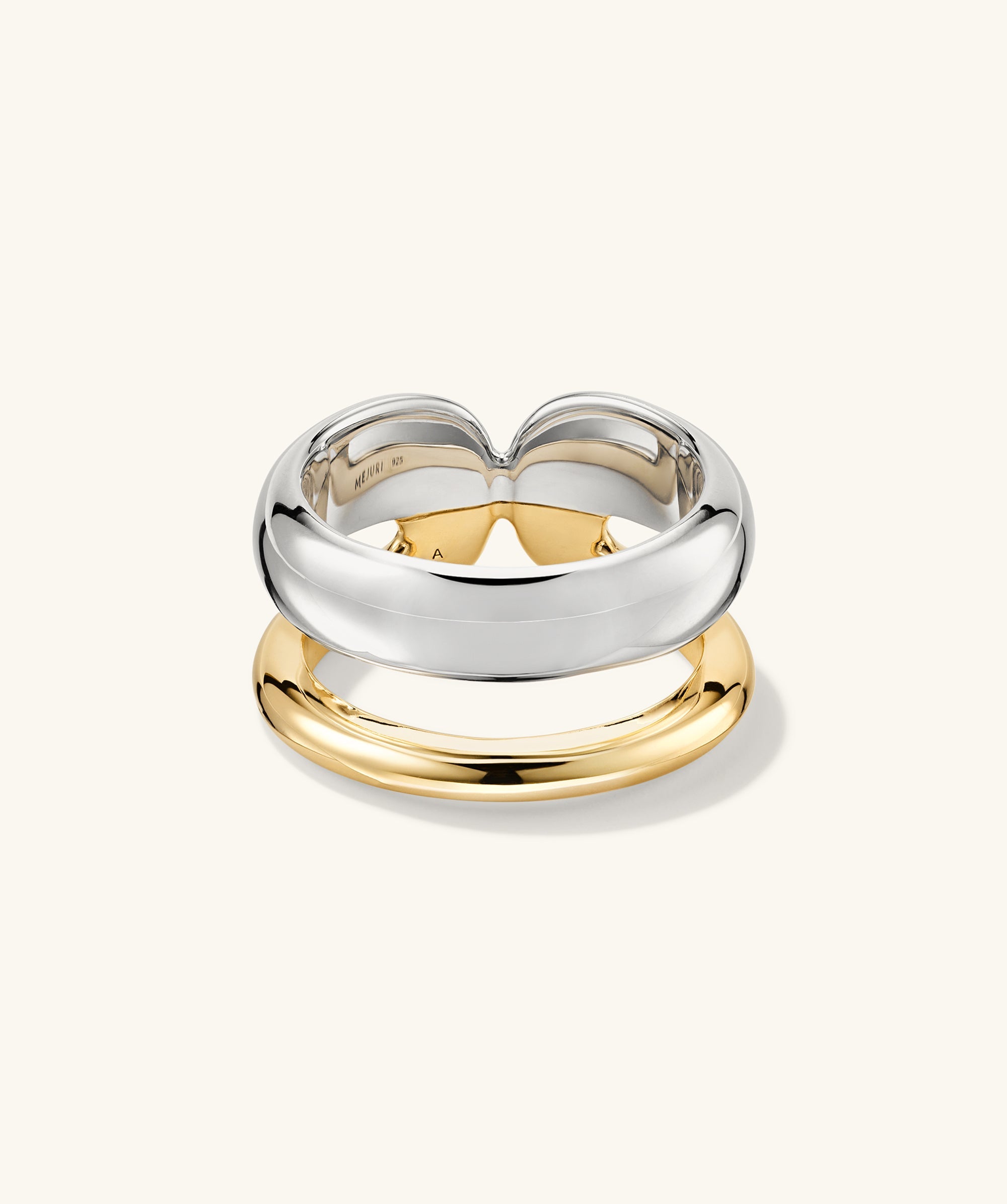 Duet Mixed Ring, featuring a close-up of a handcrafted ring with dual-width bands in 18k gold vermeil and sterling silver.